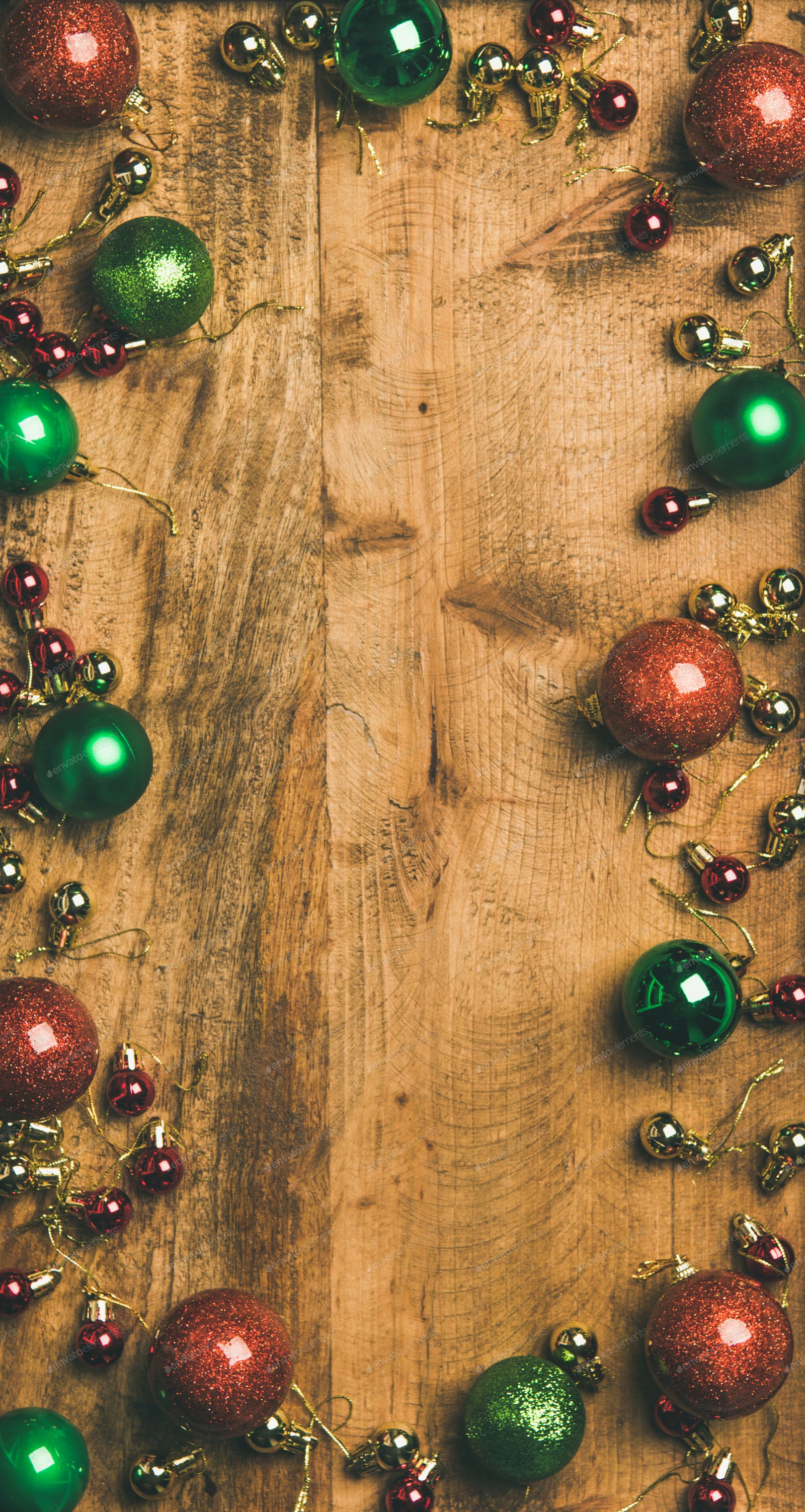 Christmas tree decoration balls on wooden background, vertical composition photo by sonyakamoz on Envato Elements