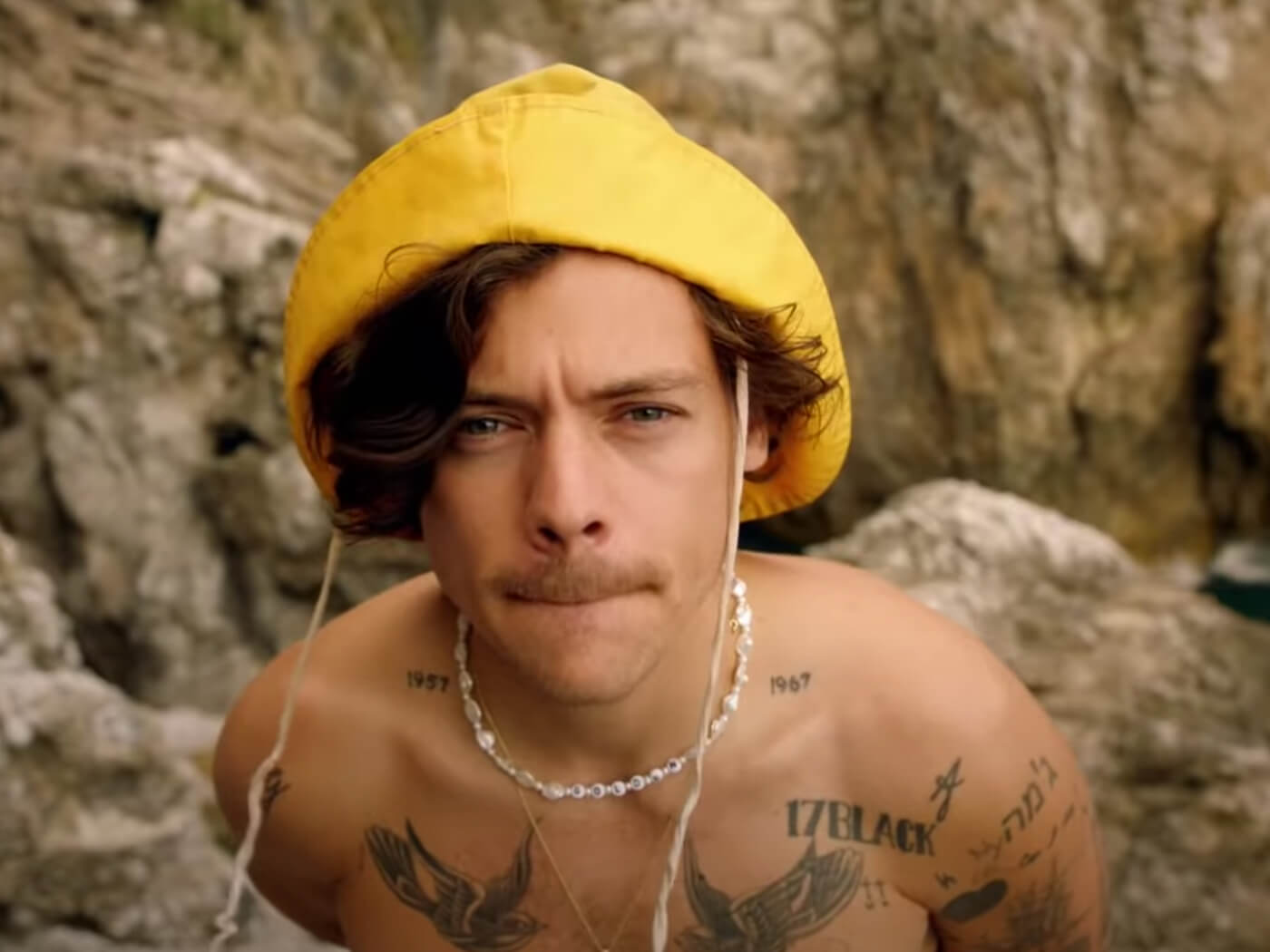 Watch Harry Styles run for his life in video for “Golden”