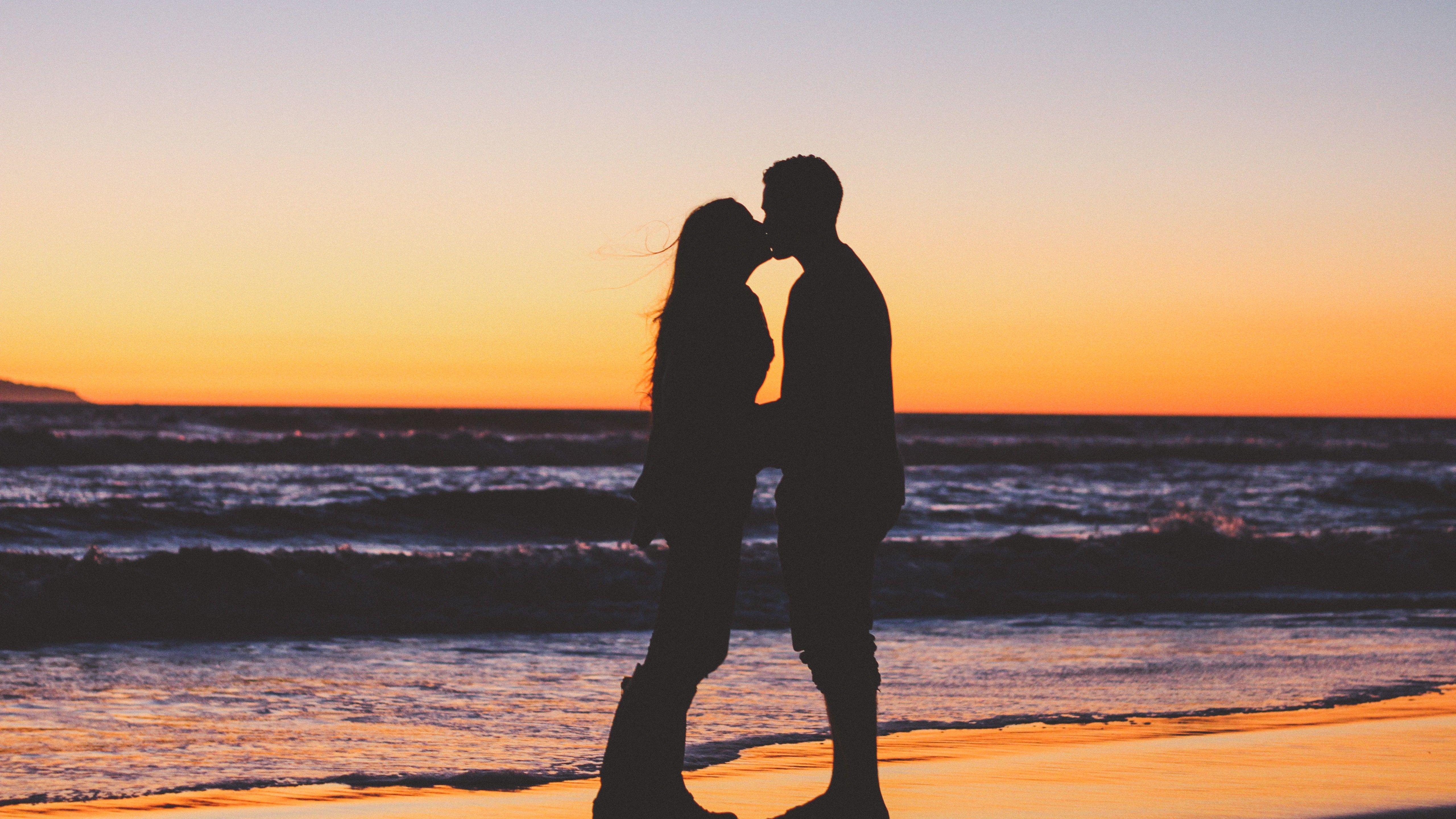 Girlfriend and Boyfriend Kiss at Sunset 5K Image
