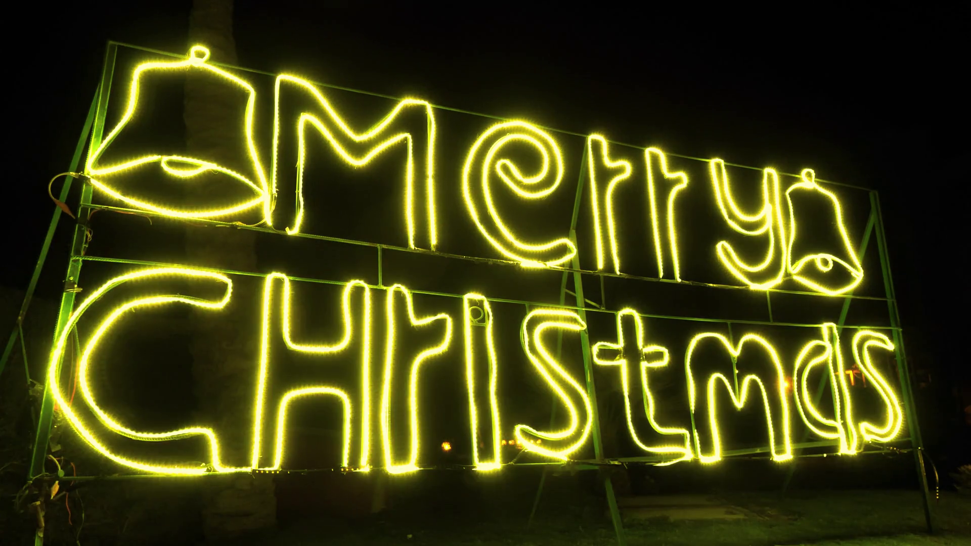 Yellow neon night signboard with message Merry Christmas Stock Video Footage
