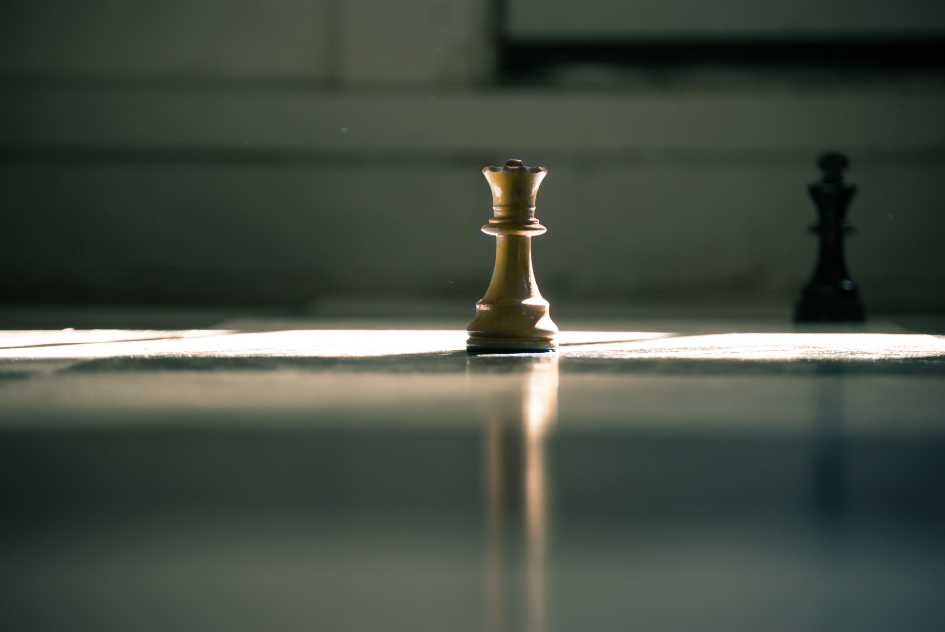 white queen chess piece on white surface photo
