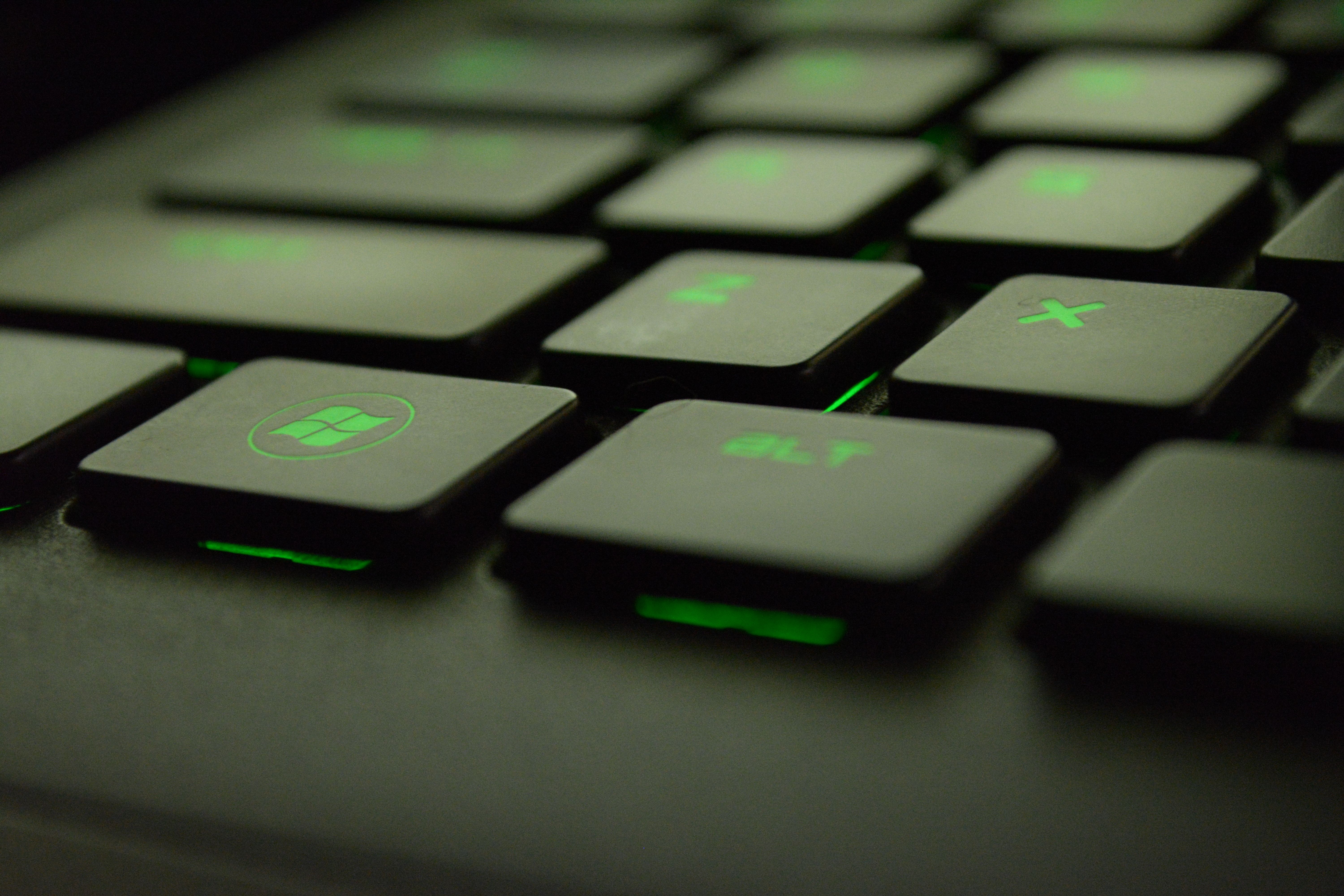 Close Up Photography Of Black And Green Computer Keyboard Keys · Free