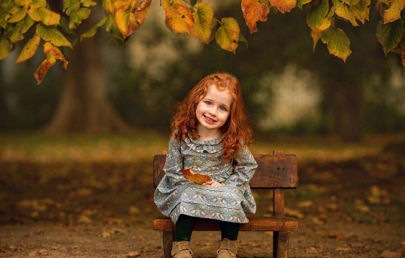 Wallpaper autumn, look, leaves, branches, smile, mood, girl, red, curls, redhead, baby, the bench image for desktop, section настроения
