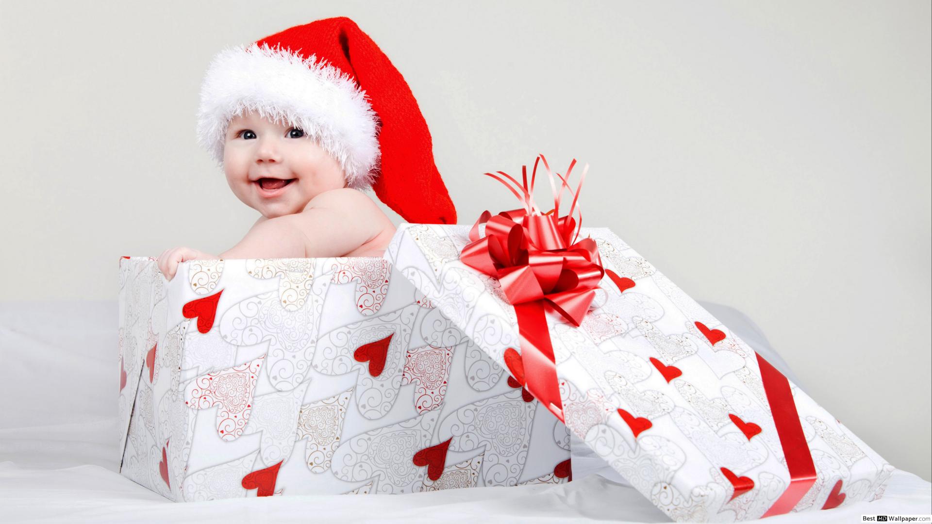 Smiling cute baby inside the gift box and the best Christmas HD wallpaper download