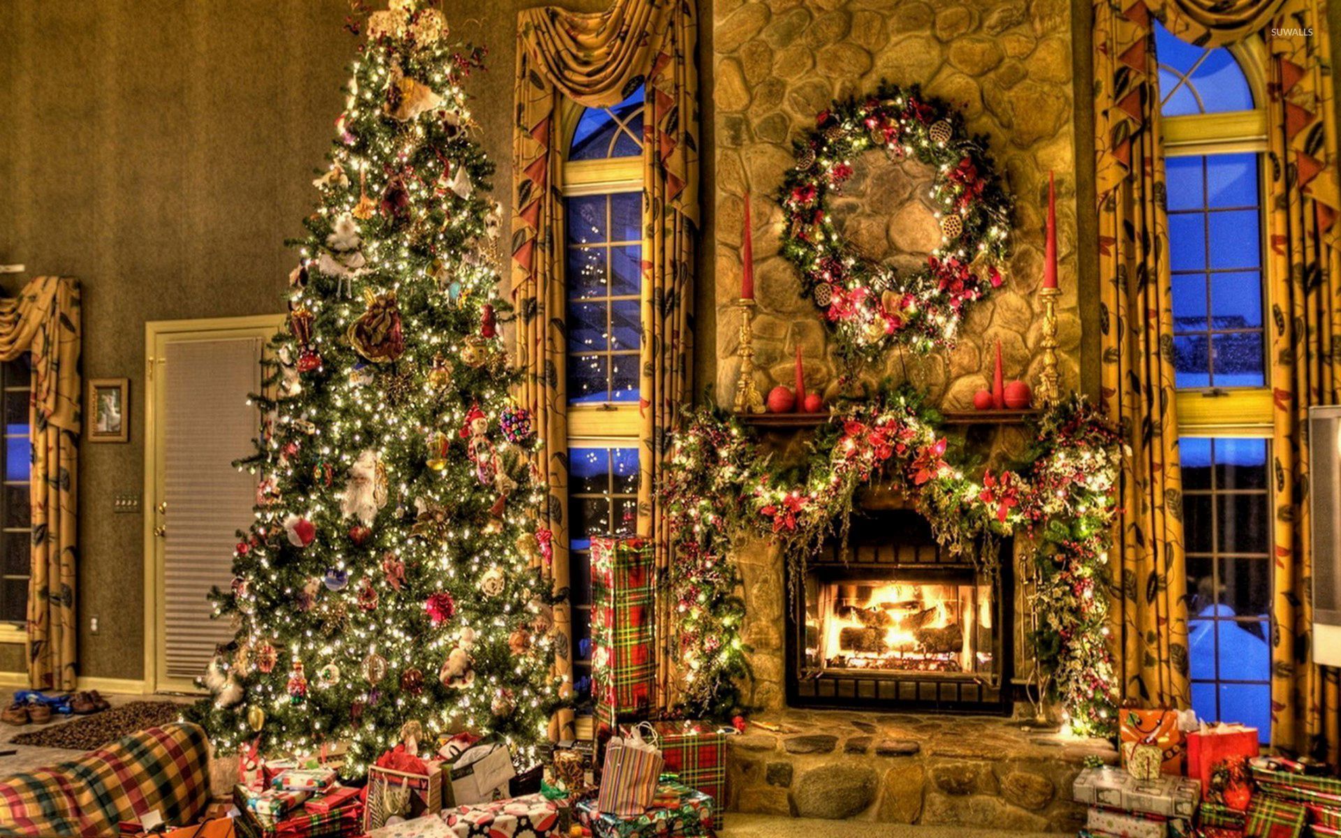 Beautiful Christmas tree by the fireplace wallpaper wallpaper