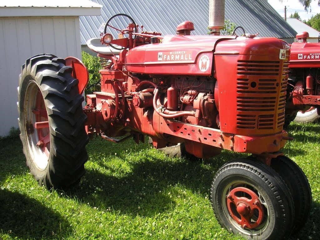 Farmall Super M Tractor. Hager Auction Service