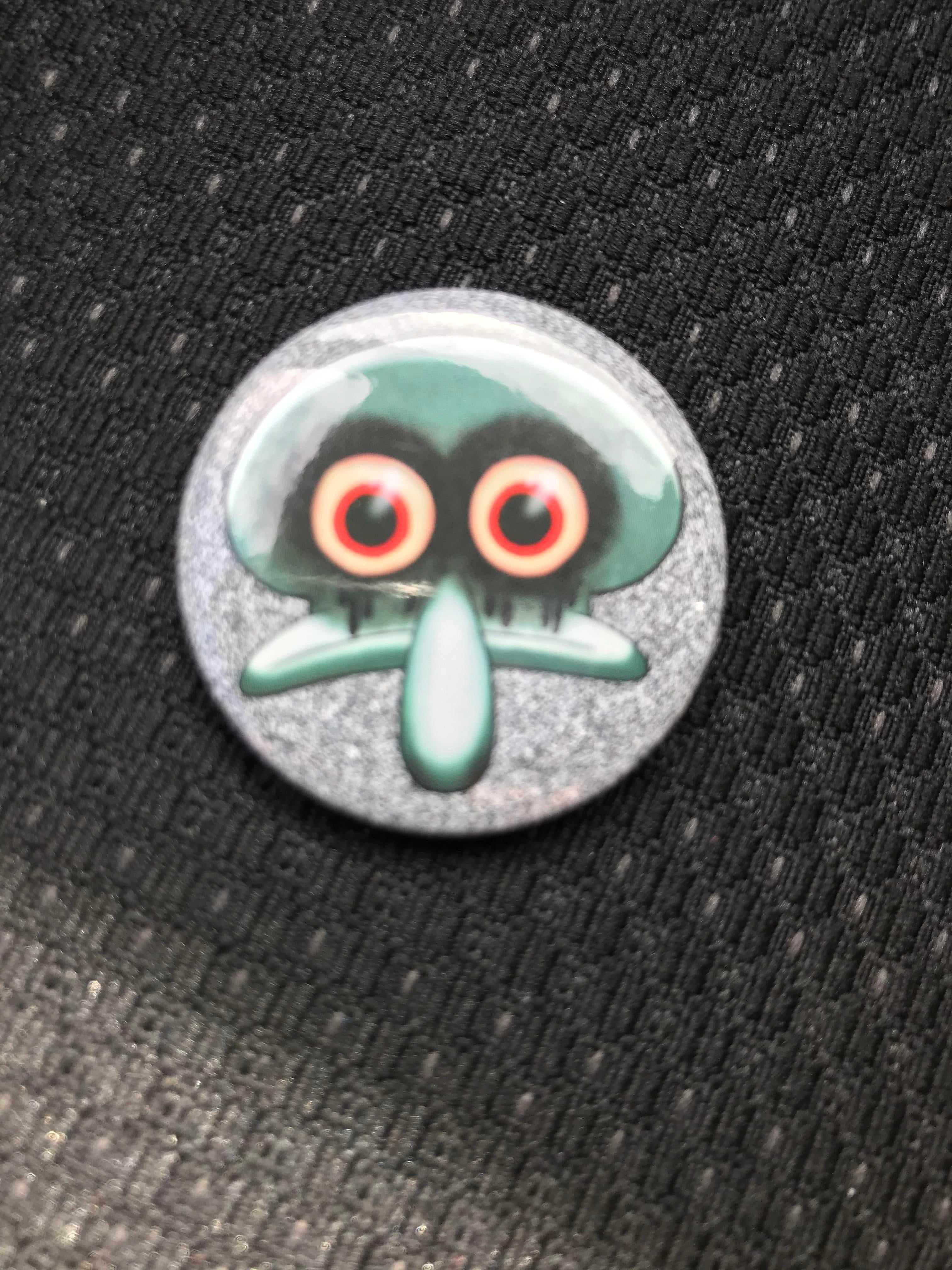 Hot Topic has a Red Mist Squidward pin!