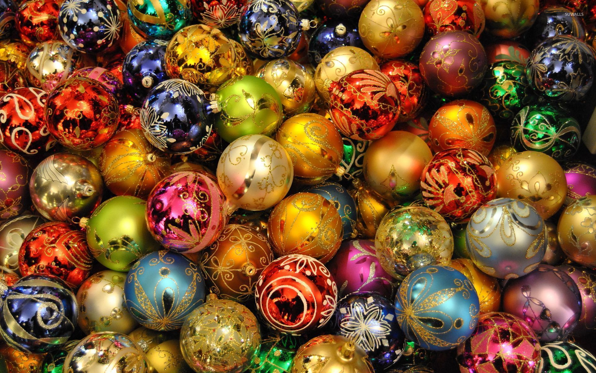 Christmas lights reflecting in the colorful baubles wallpaper wallpaper