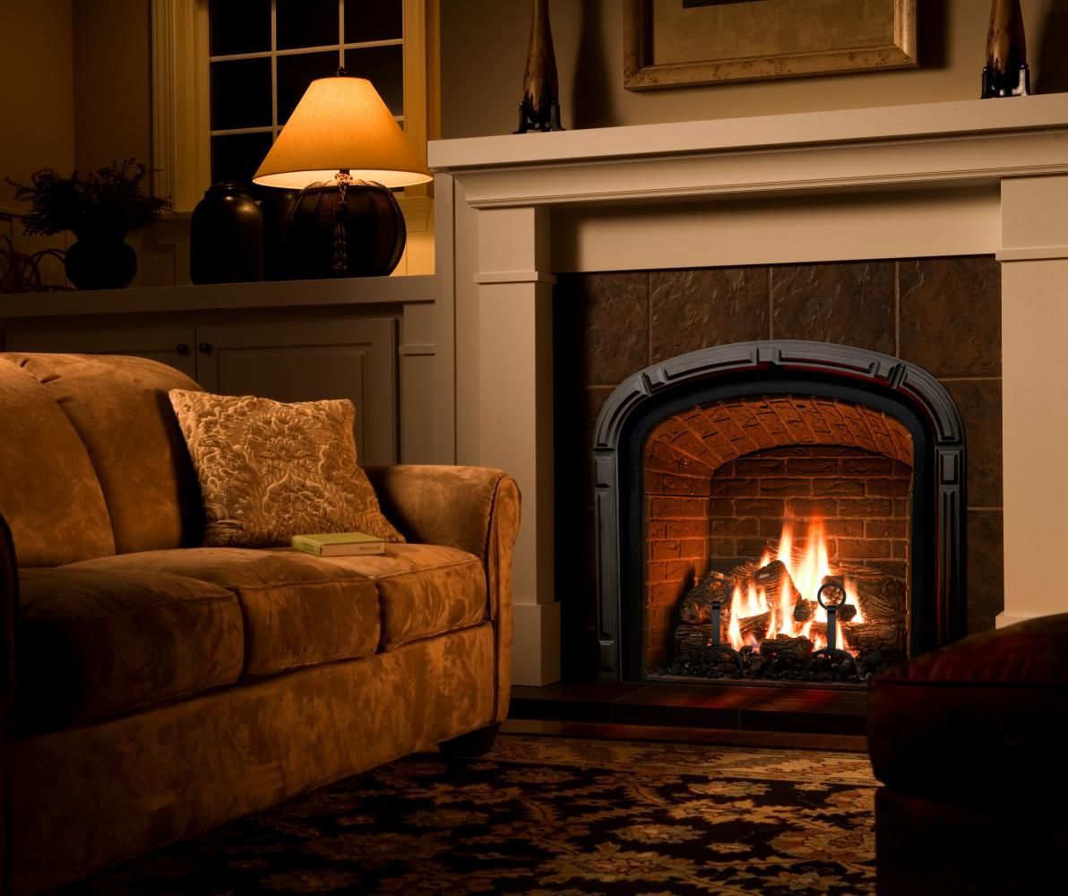 A beautiful #fireplace with a burning fire can easily warm a #room and create the perfect atmosphere for. Fireplace design, Family room design, Cozy living rooms