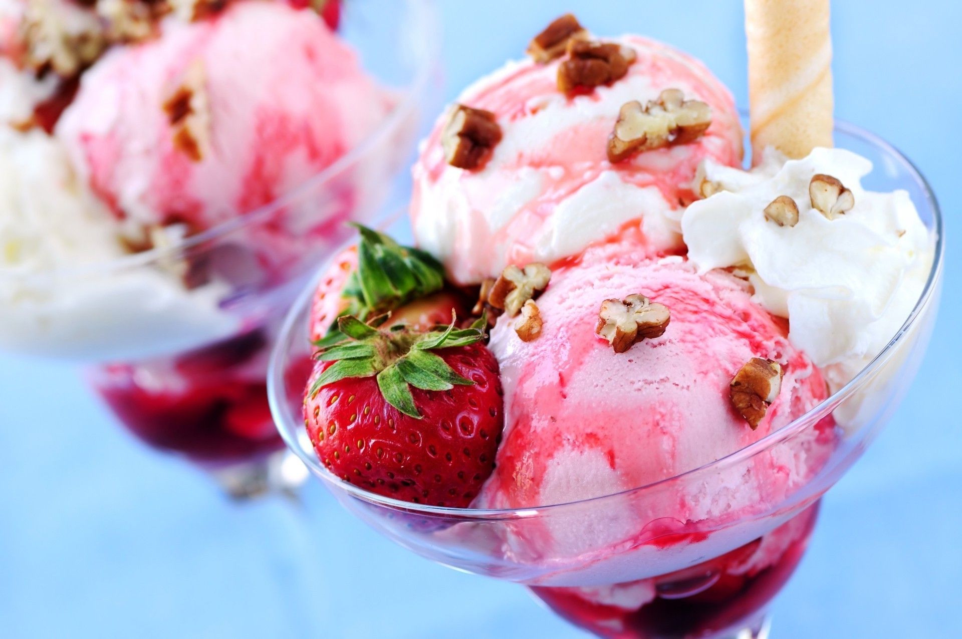 A glass of ice cream with strawberries