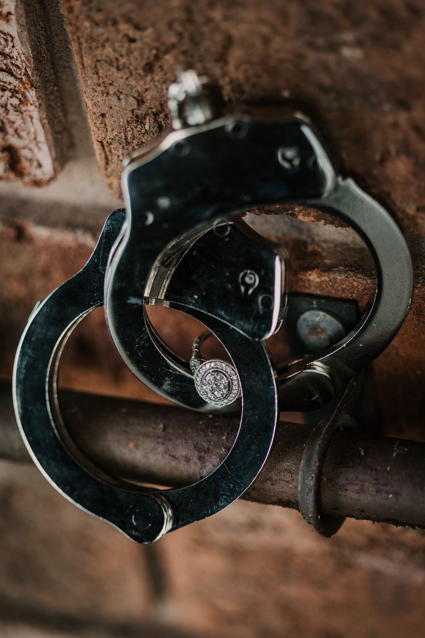 Ring shot in pair of handcuffs belonging to police officer. Vancouver wedding photographer, Vancouver wedding, Wedding photographers