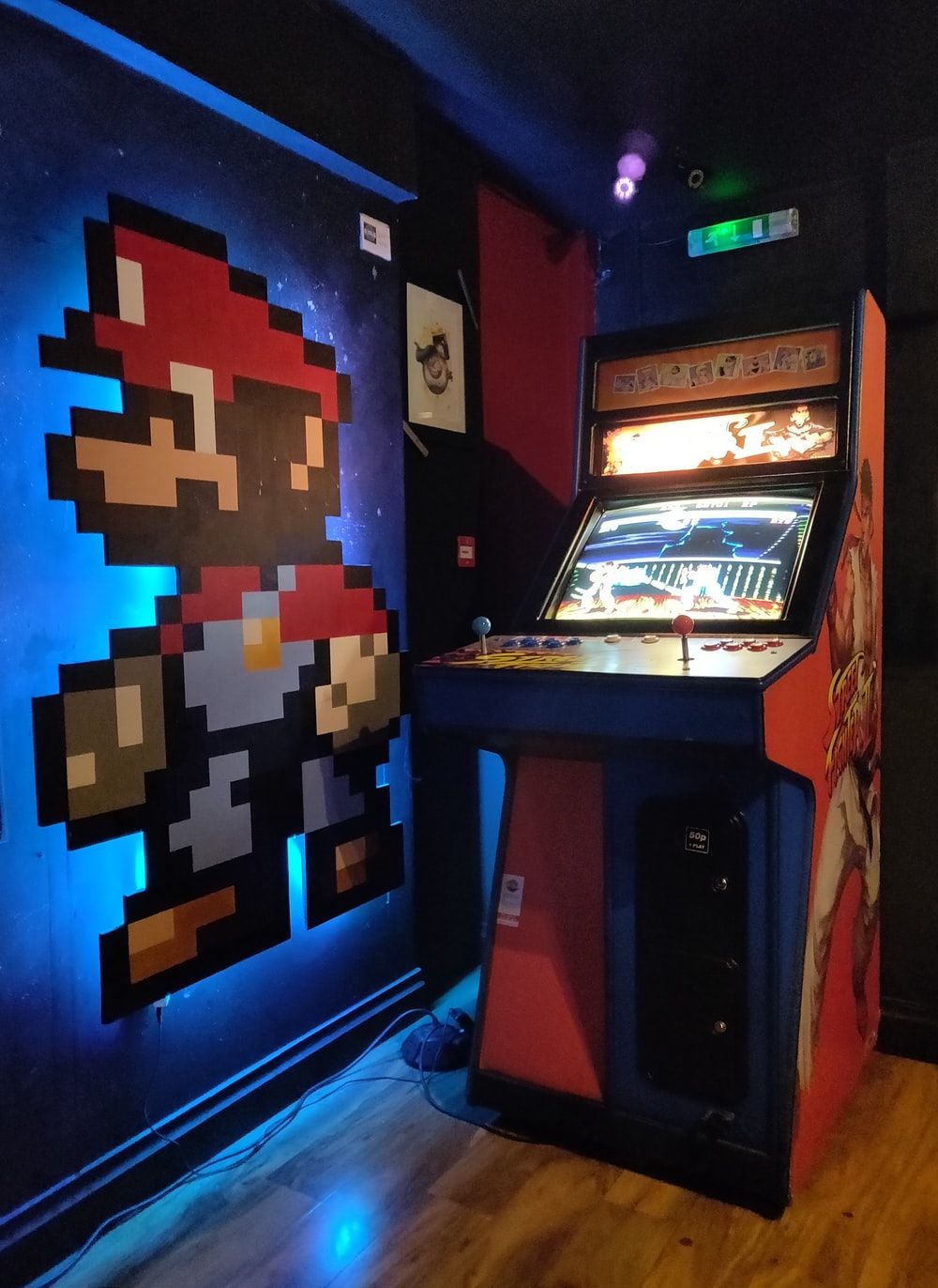 black and red arcade machine photo