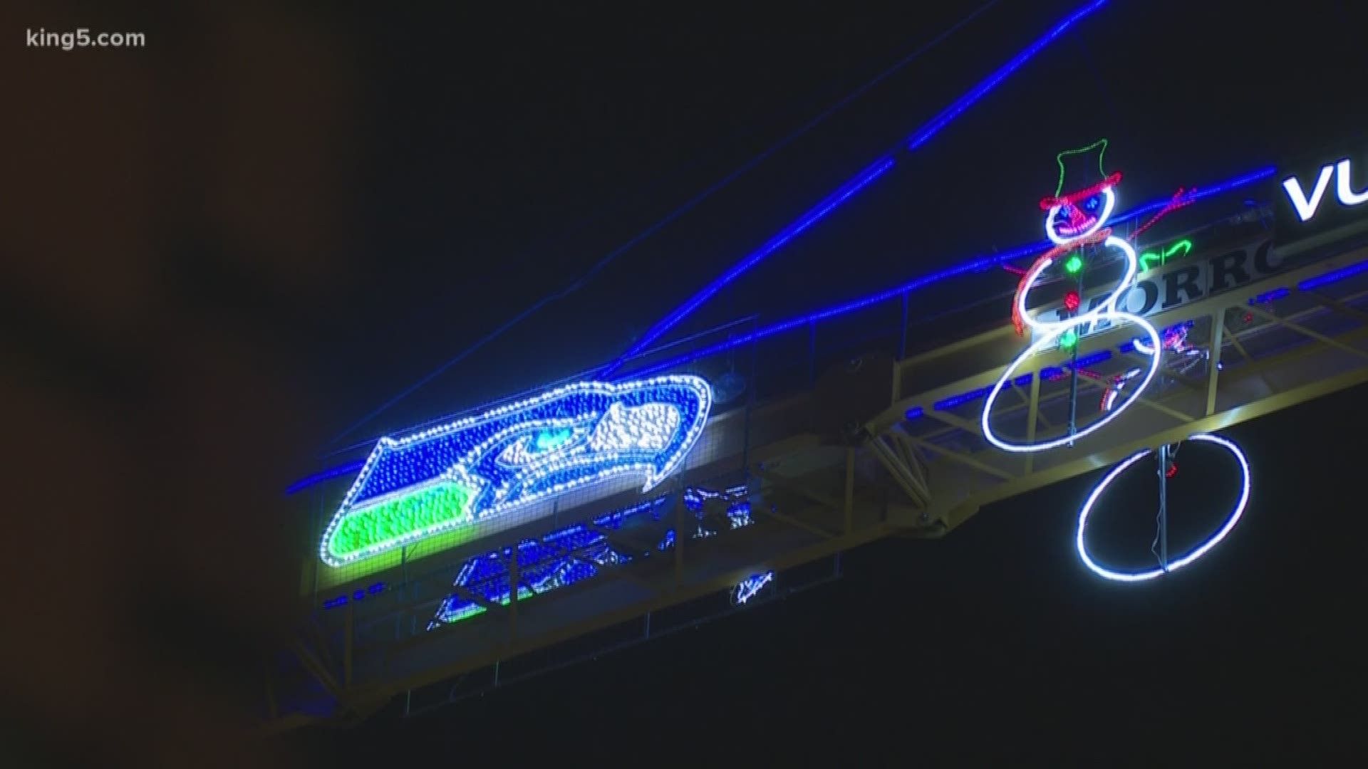 How they put Christmas lights on Seattle cranes