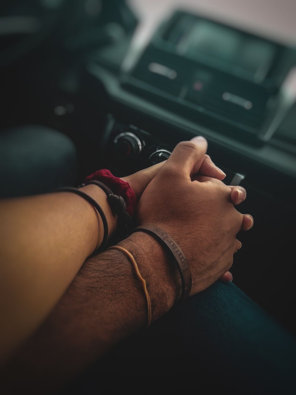 people holding hands together photo