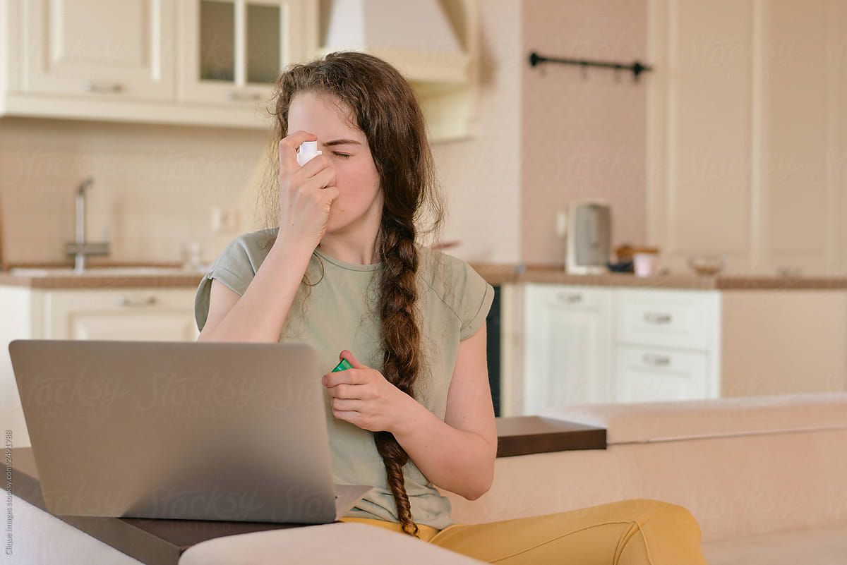 Young Woman Using Inhaler by Clique Image, Breath