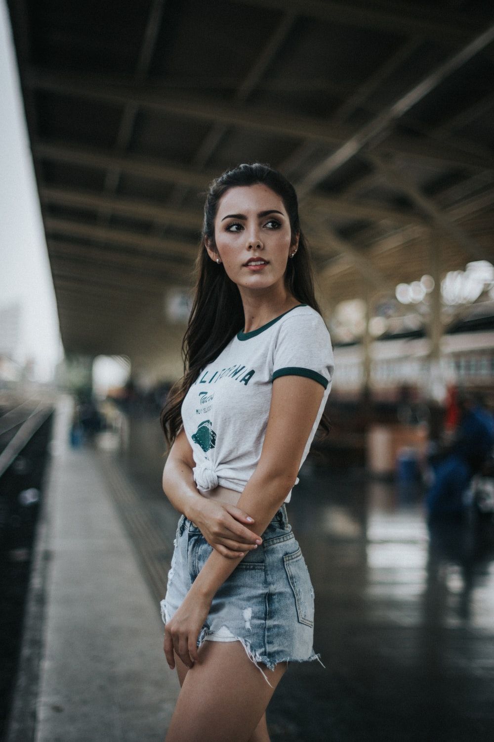 woman standing in front of train photo
