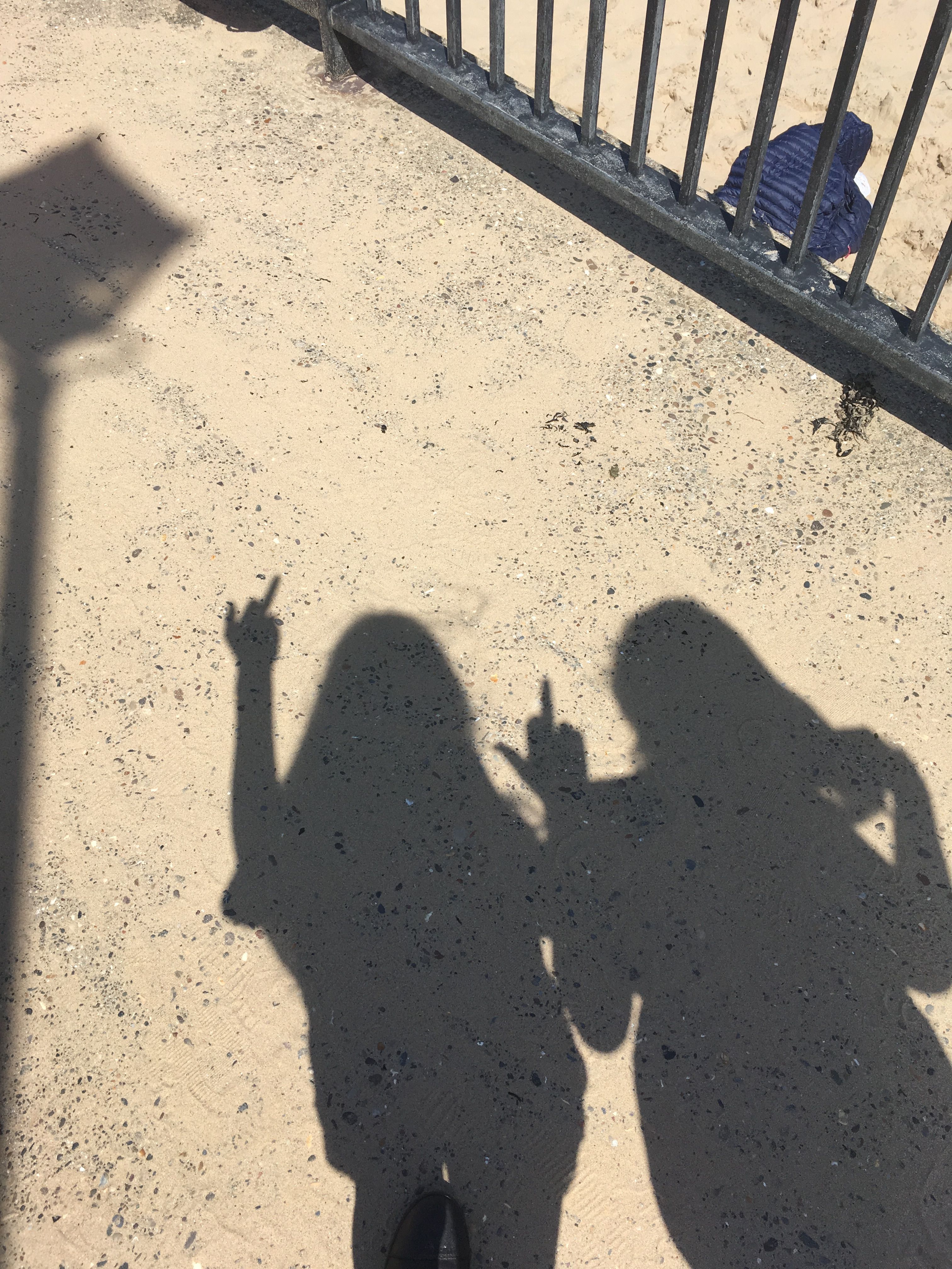 shadow #shadows #friends #friendship #middlefinger #sand #beach #railing #metal. Shadow picture, Beach picture friends, Girl shadow