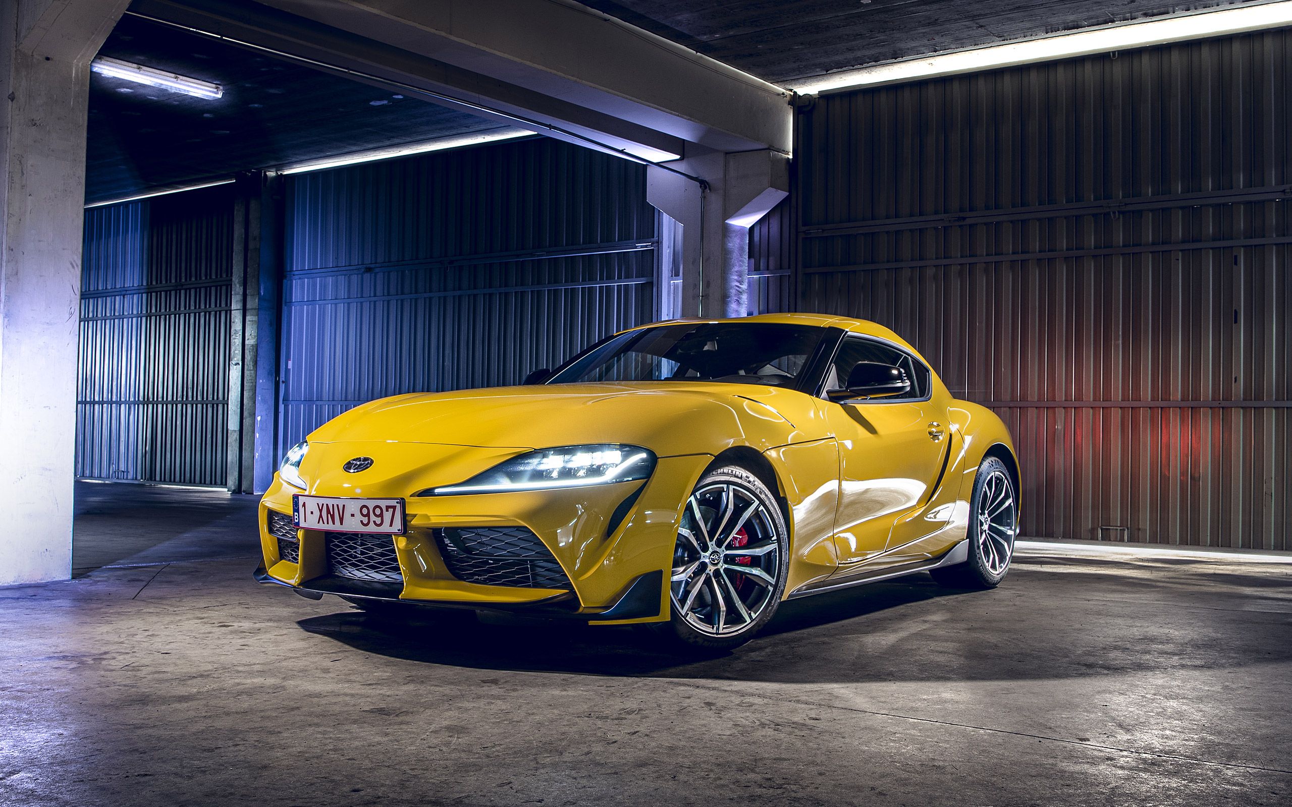 Download wallpaper Toyota Supra, 2021, yellow sports coupe, front view, exterior, sports car, new yellow Supra, japanese cars, Toyota for desktop with resolution 2560x1600. High Quality HD picture wallpaper