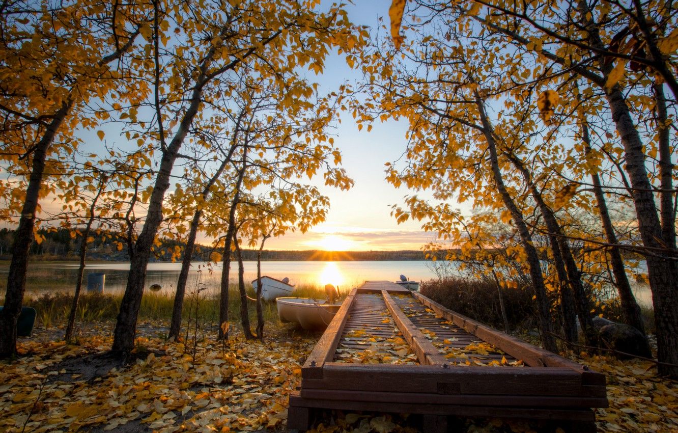 Wallpaper autumn, the sky, leaves, the sun, clouds, rays, trees, sunset, lake, blue, shore, boats, the evening, yellow, Canada image for desktop, section природа