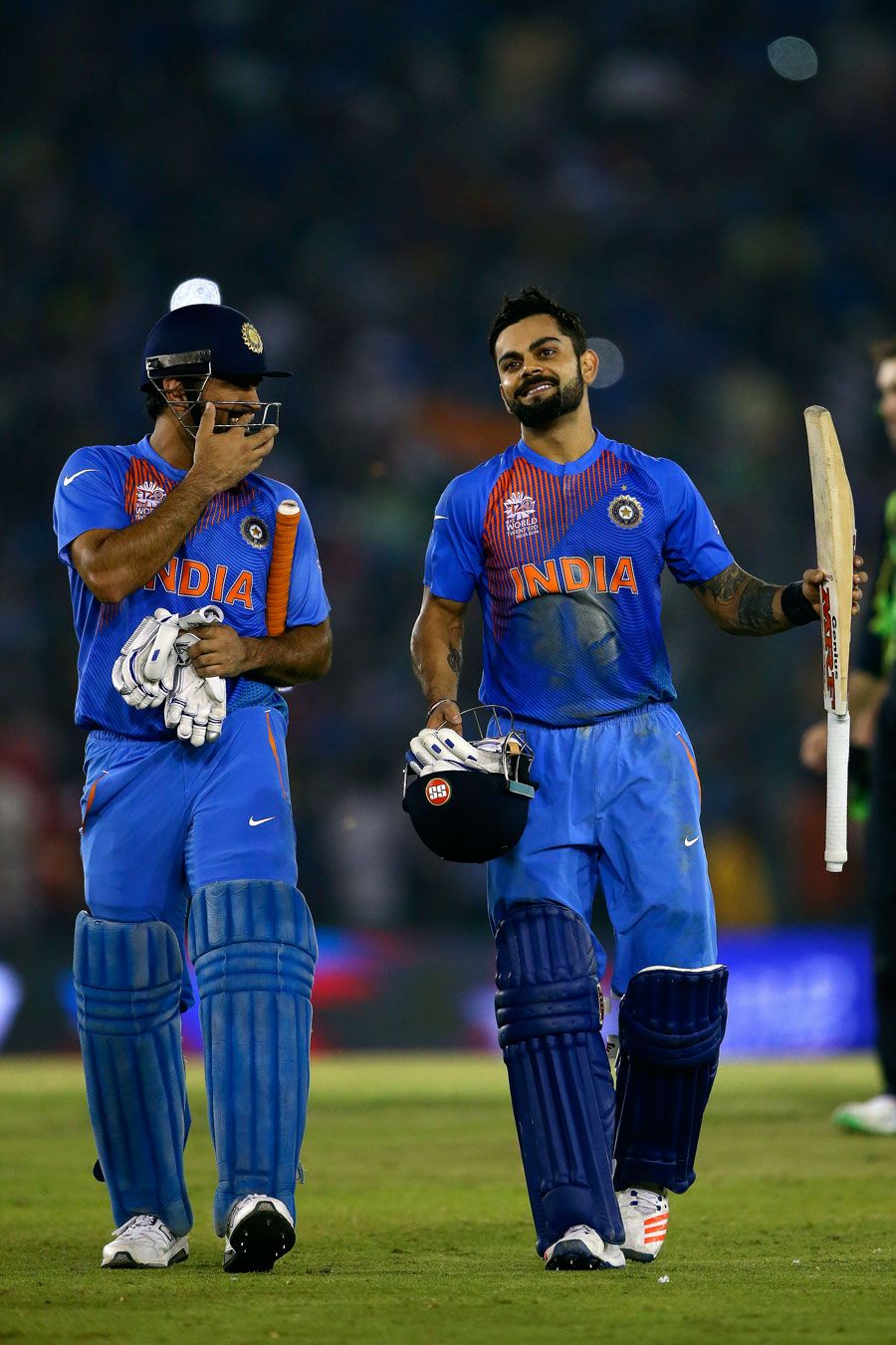 MS Dhoni and Virat Kohli share a laugh after taking India home