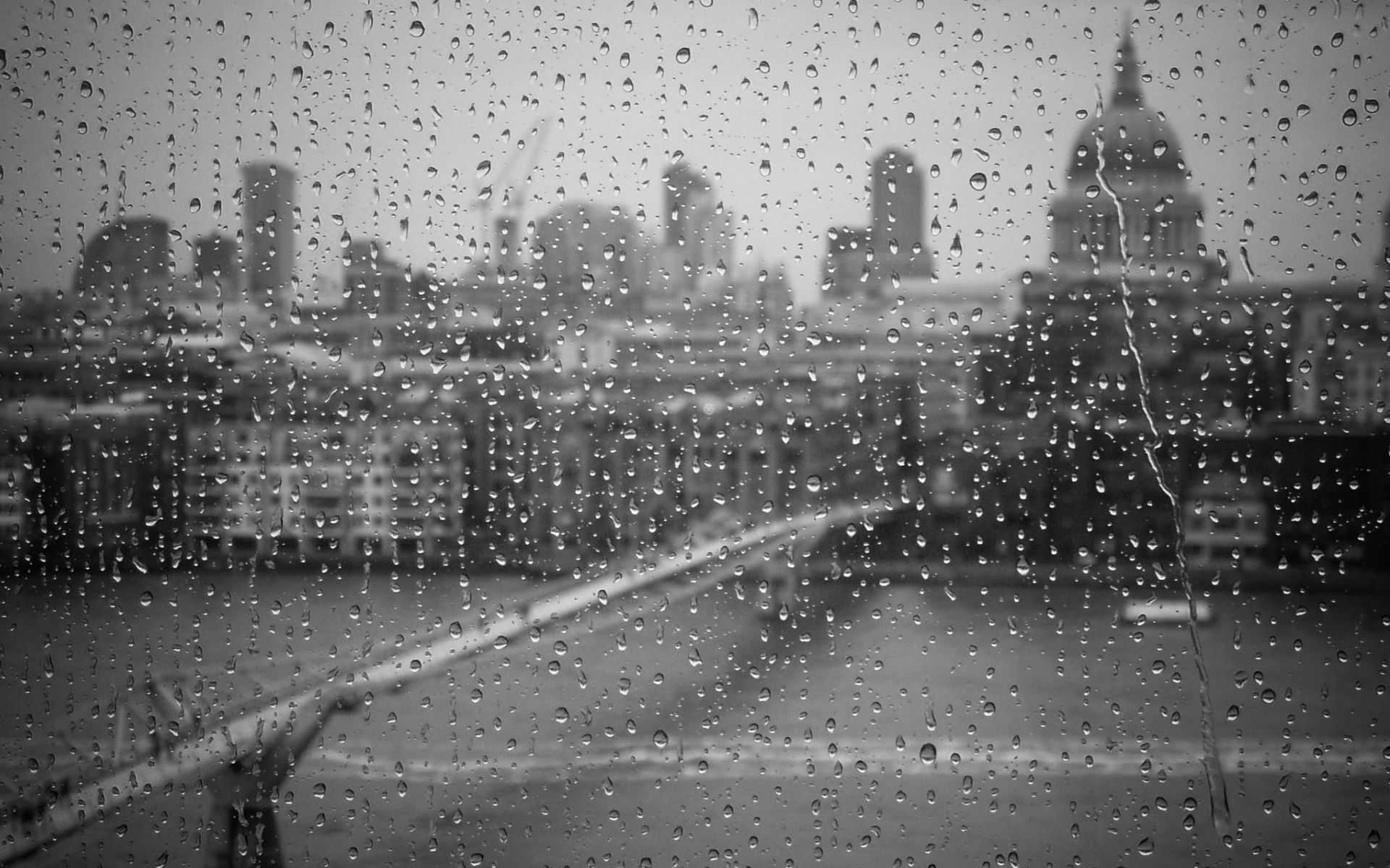 Black Wallpaper photo rain Glass drops of the white city