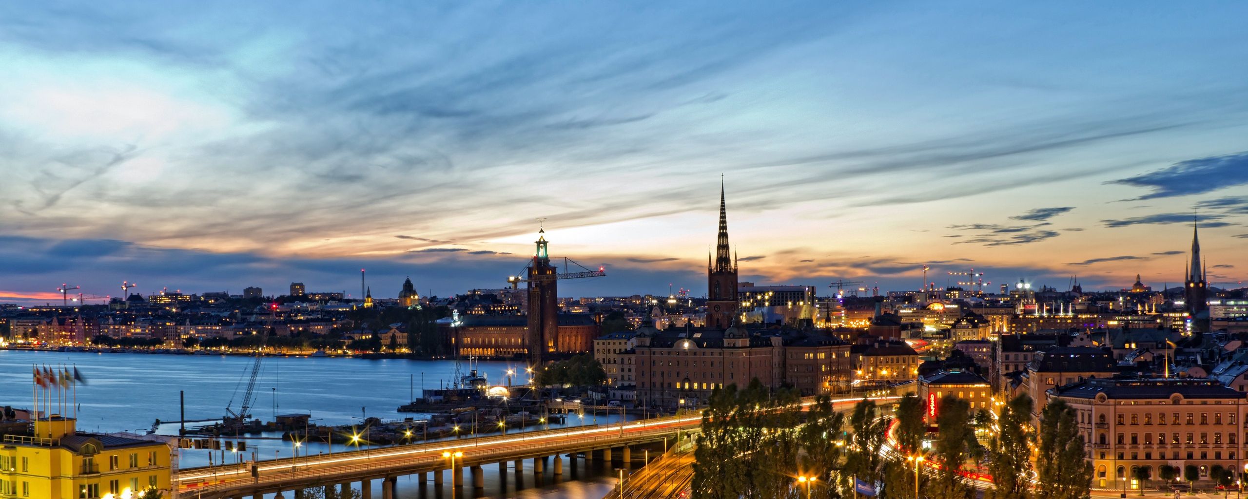 Free download 2560x1024 Stockholm Sweden Evening Lights of the city Wallpaper [2560x1024] for your Desktop, Mobile & Tablet. Explore Stockholm Wallpaper. Swedish Wallpaper, Swedish Flag Wallpaper, Wallpaper Story