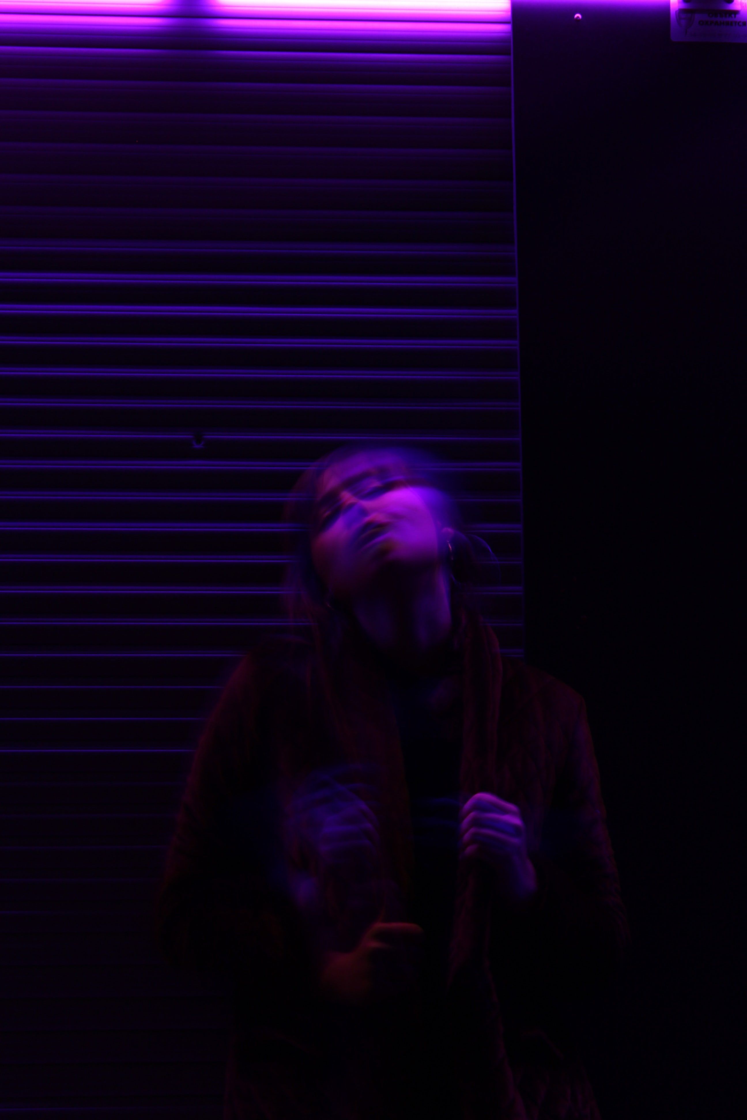 A motion blur shot of a young woman under purple lighting in Kaliningrad. Motion blur, Purple, Purple wallpaper