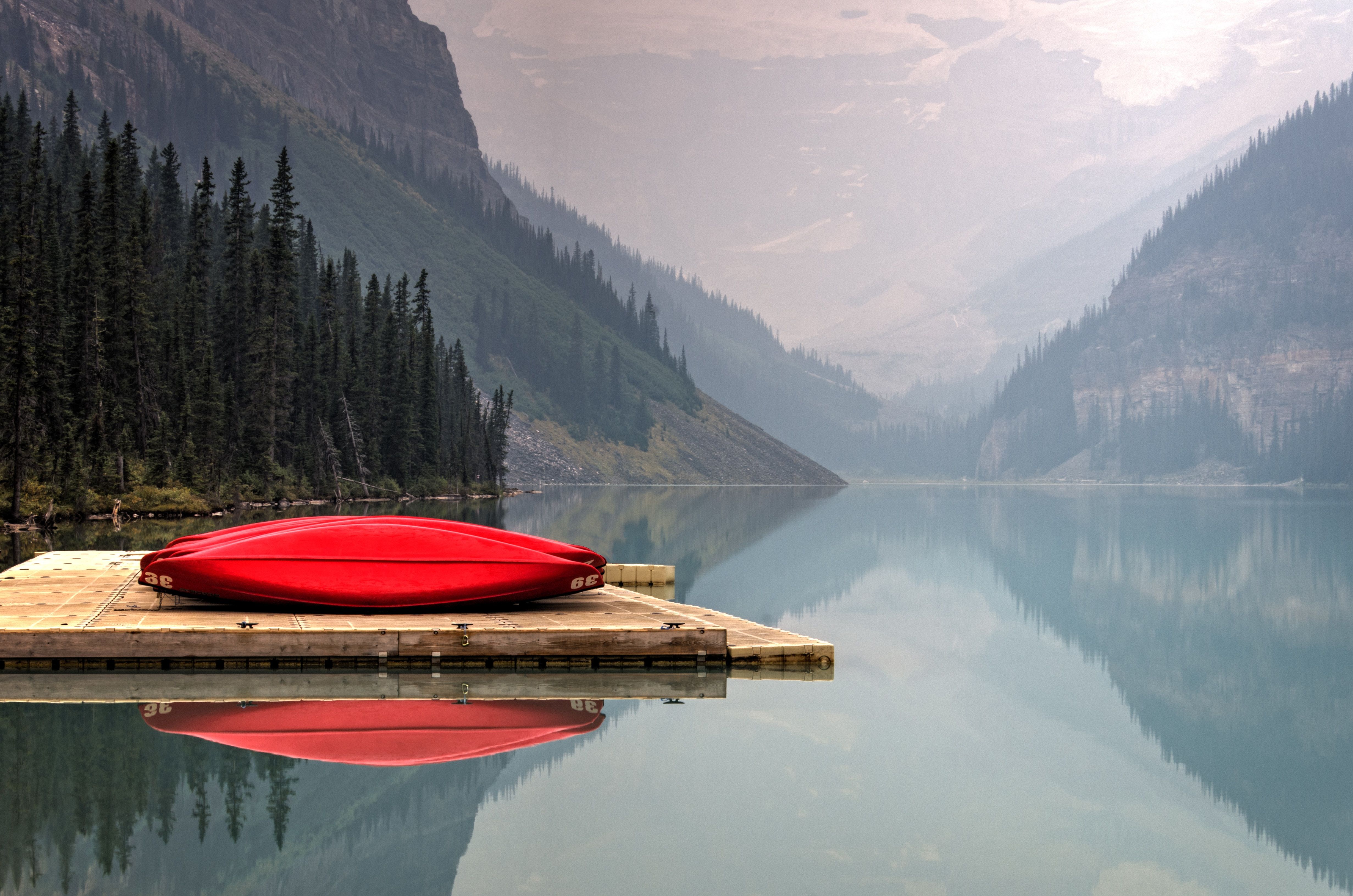 4924x3262 #wallpaper, #reflection, #lake, #cano, #wilderness, #forest, #nature wallpaper, #mountain, #peaceful, #nature background, #dock, #lake louise, #boat, #Creative Commons image, #mountain range, #kayak, #red kayak, #red, #canoe, #tree