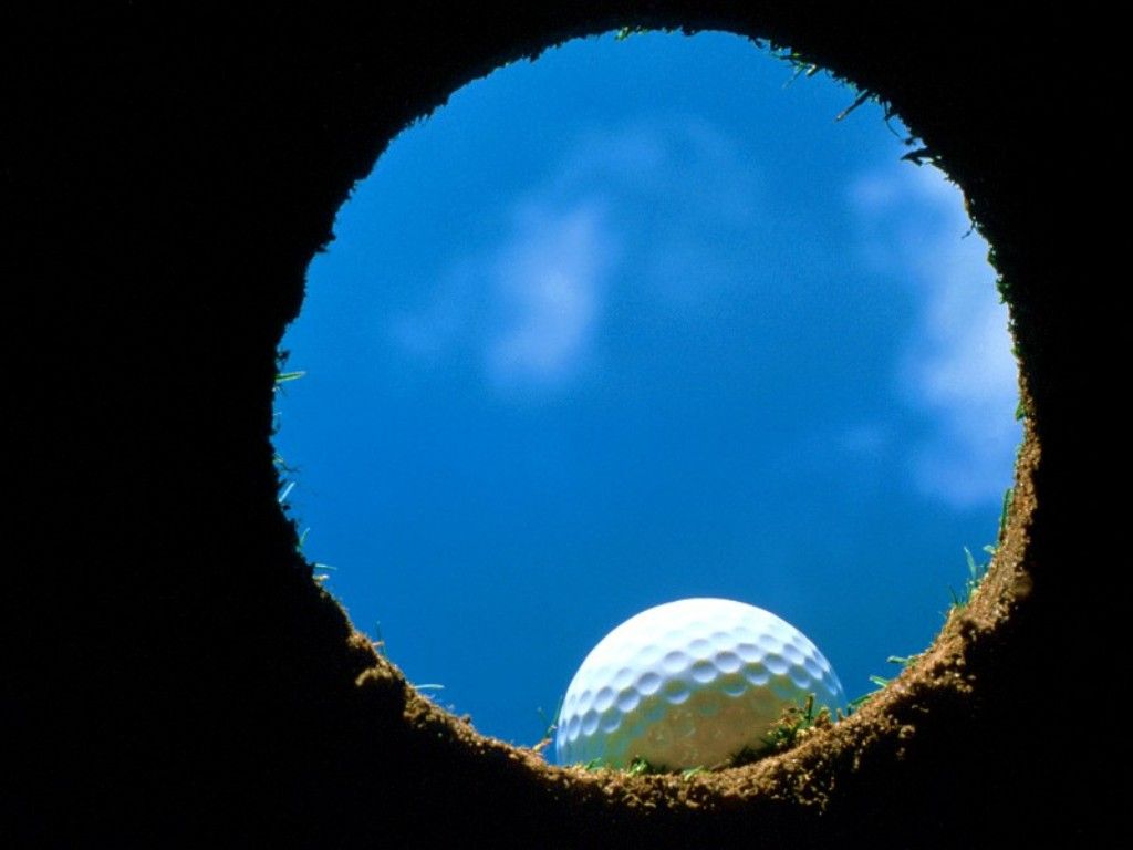 Golf Ball At Lip Of Hole From Inside