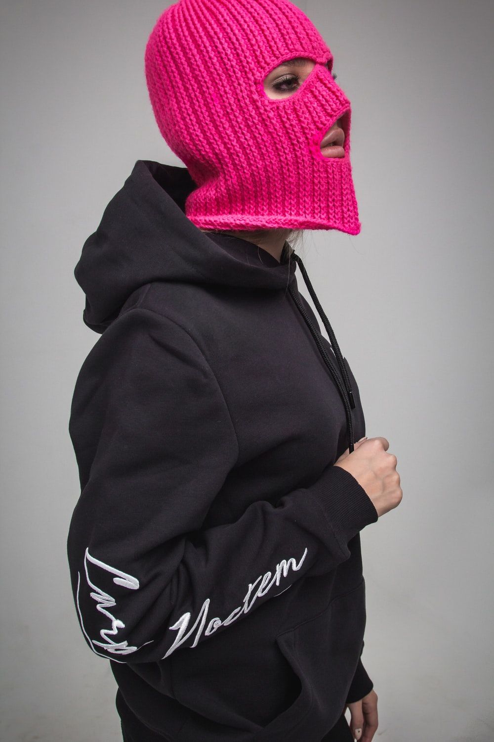 woman wearing pink knitted mask photo