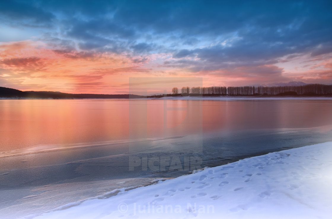 Incredibly beautiful sunset.Sun, sky, lake.Sunset or sunrise landscape, panorama of beautiful nature. Sky with amazing colorful clouds. Water reflections.Magic Artistic Wallpaper.Dream, line.Creative Winter Background. by Juliana Nan downloads