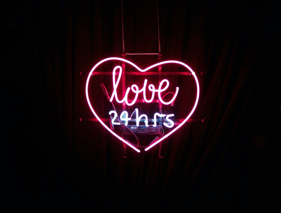 red Love 24 hours neon light sign photo .com