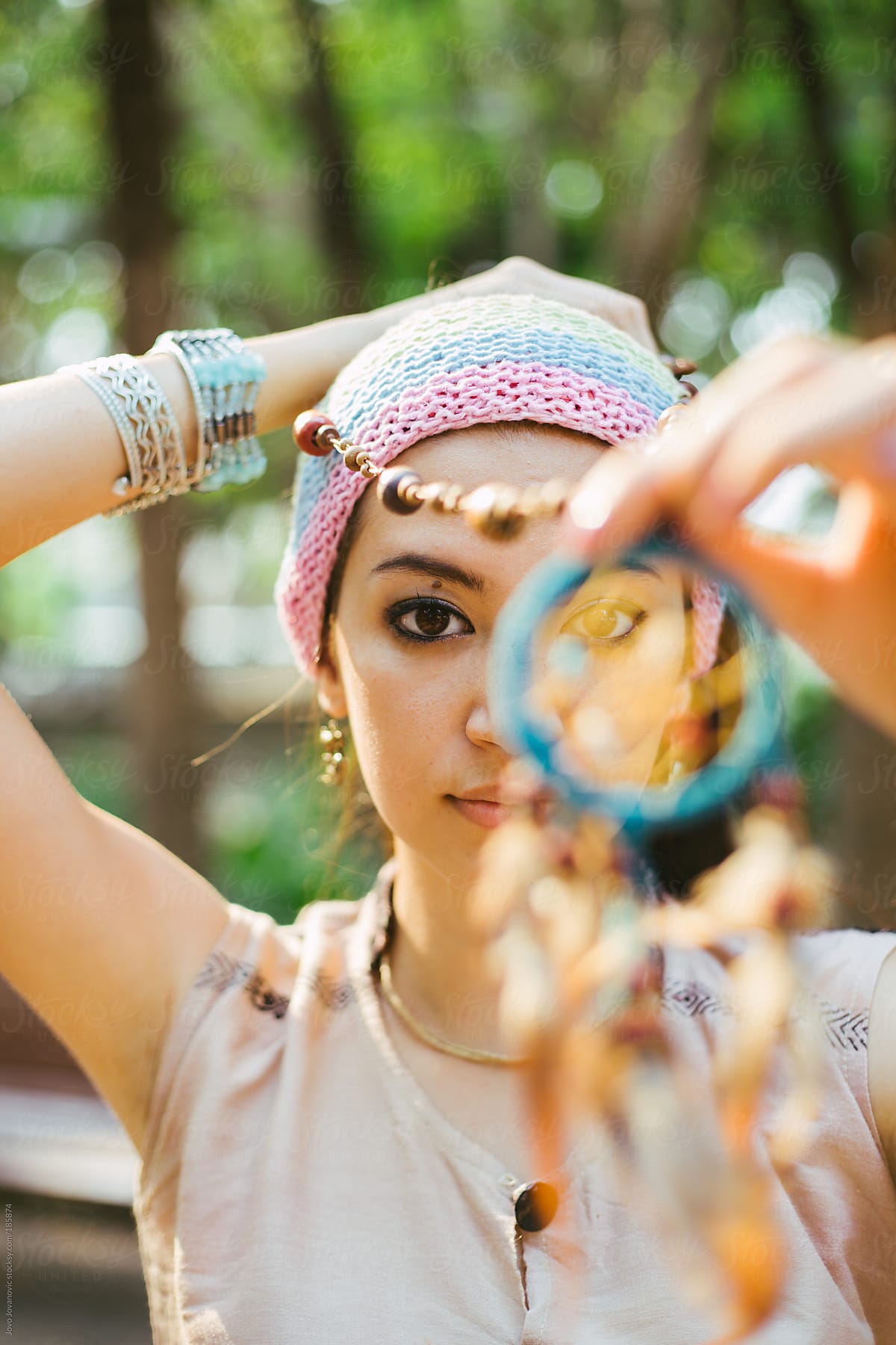 Hippie holding dream catcher in .stocksy.com