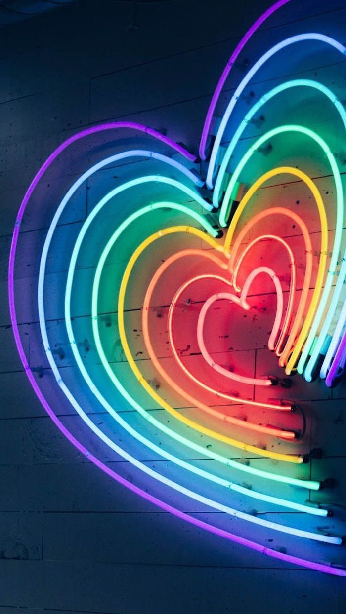 Heart Shaped Neon Lights In The Colors Of The Rainbow Aesthetic Phone Background Purple Blue Green Yellow Orange Red Pin. Neon, Neon Wallpaper, Rainbow Aesthetic
