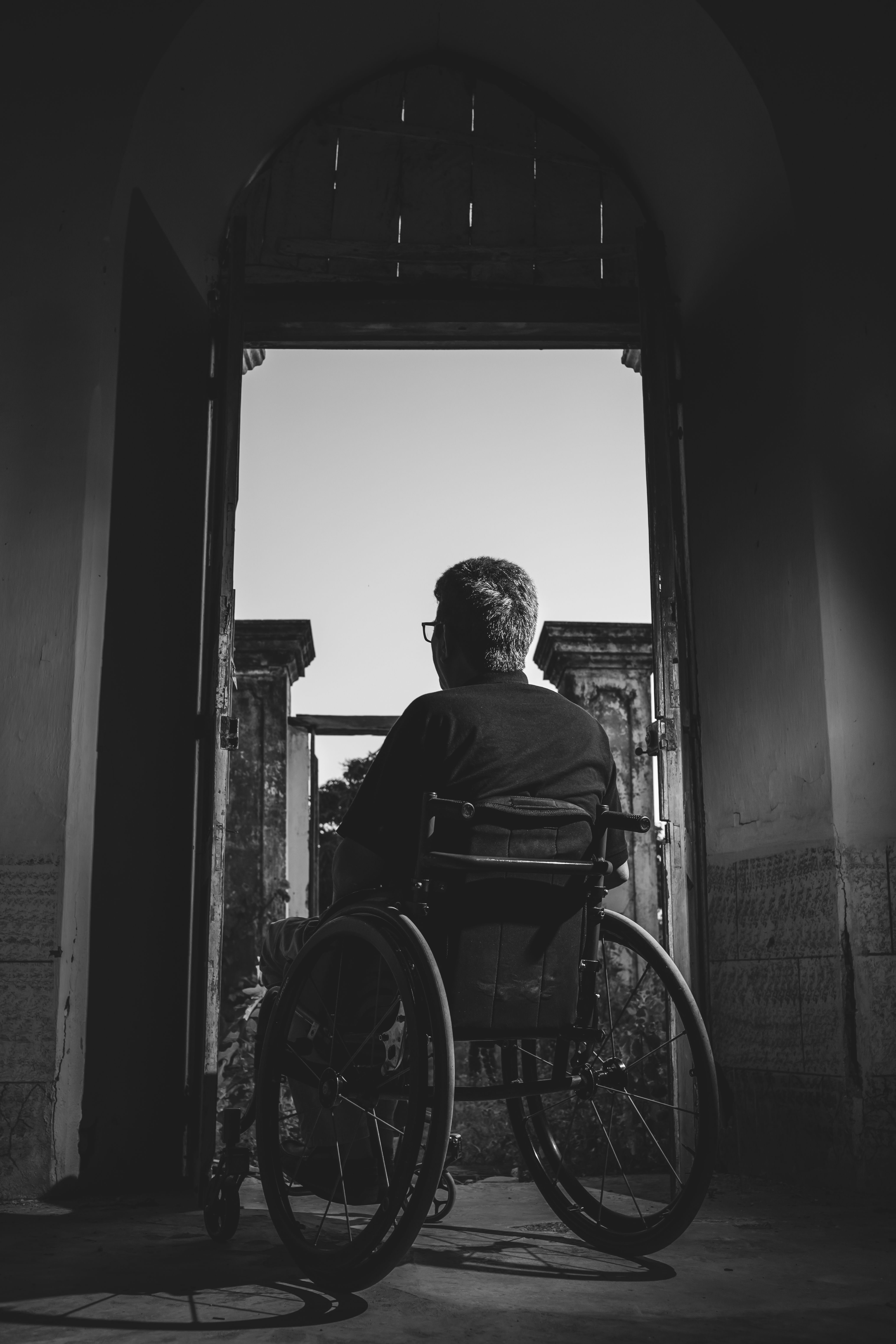 Grayscale Photography of Man Sitting on .pexels.com