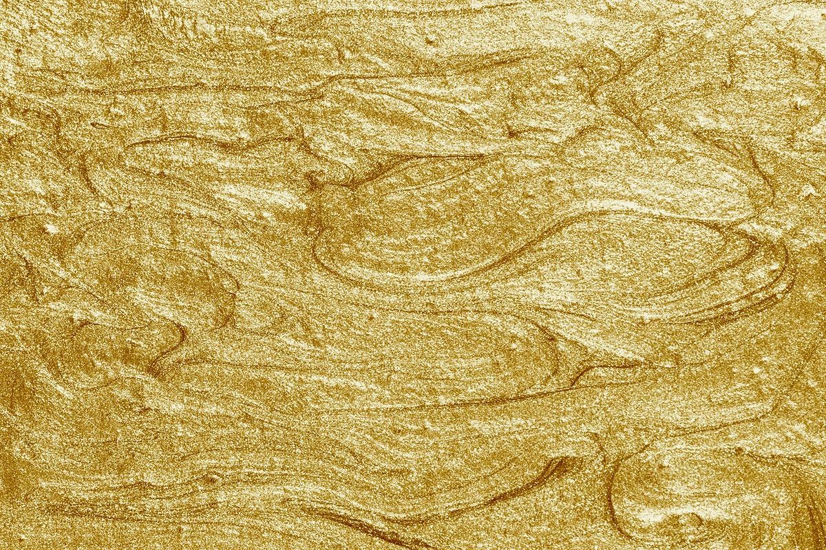 Metallic gold paint textured background .com