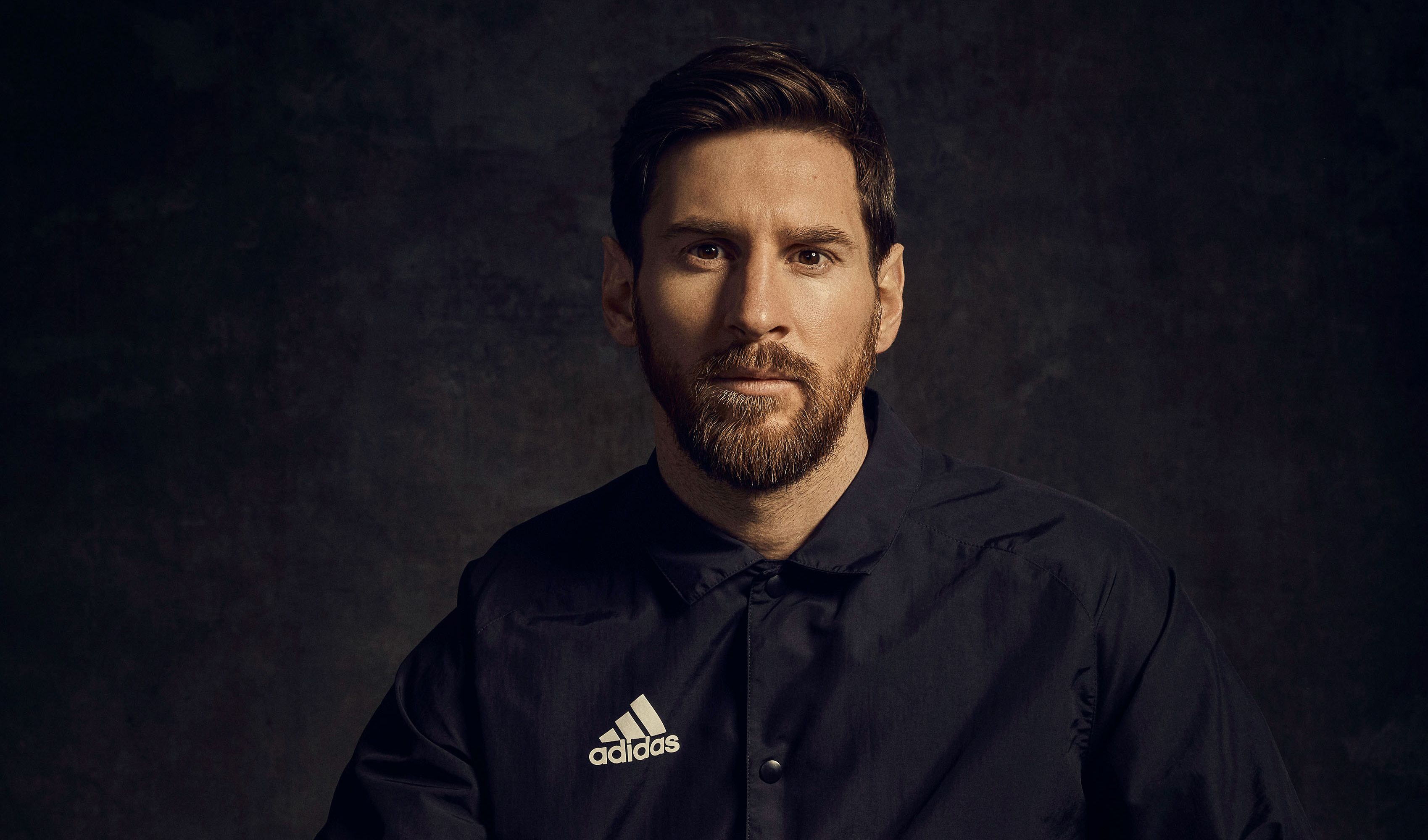 Football player Lionel Messi in a black shirt with a beard wallpaper and image, picture, photo