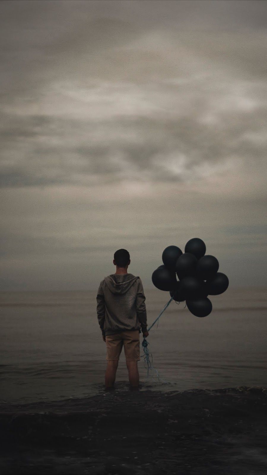 guy, balloons, sea. Magazine cover .com