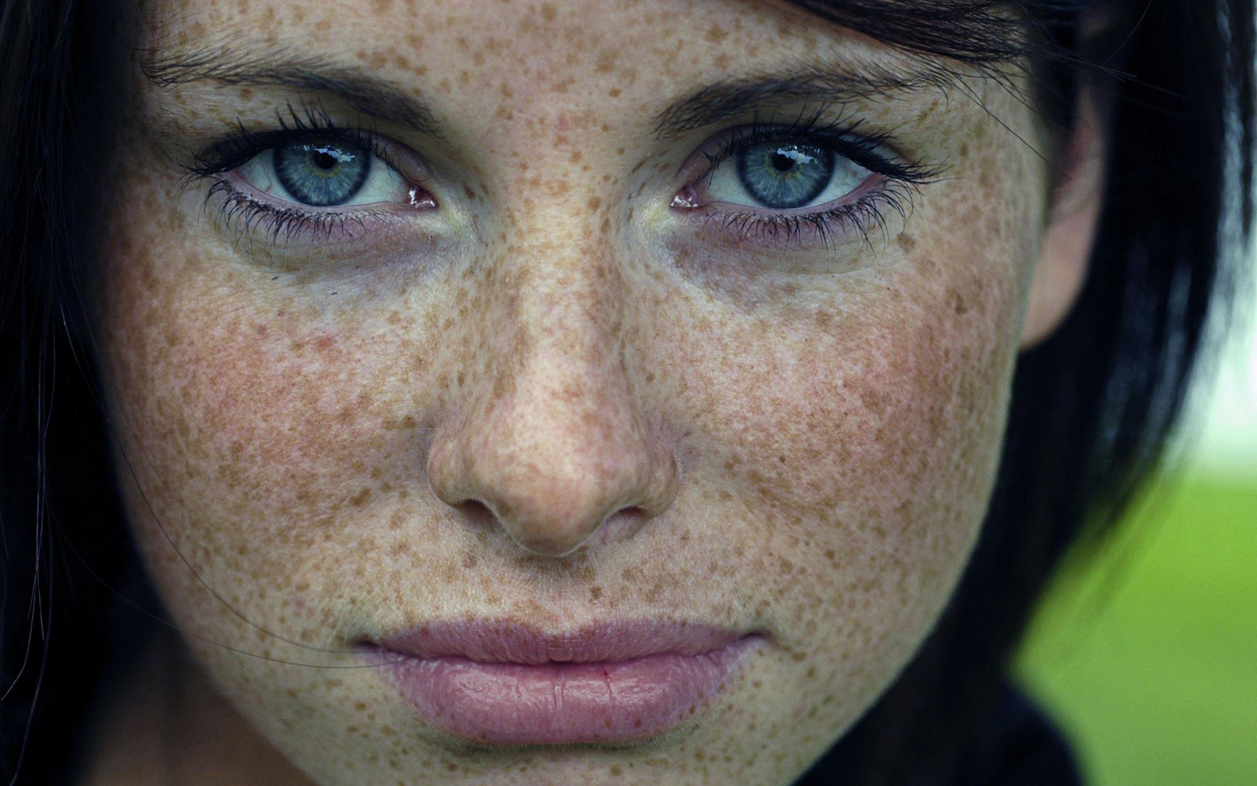 Woman blue eyes freckles