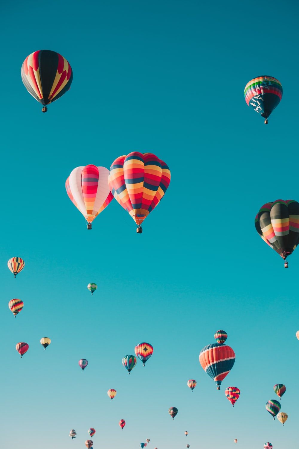 assorted hot air balloons flying at high altitude during daytime photo