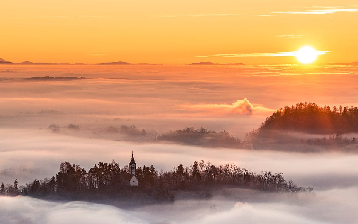 Dreamy Pixel. Church and castle hiding in the early morning fog