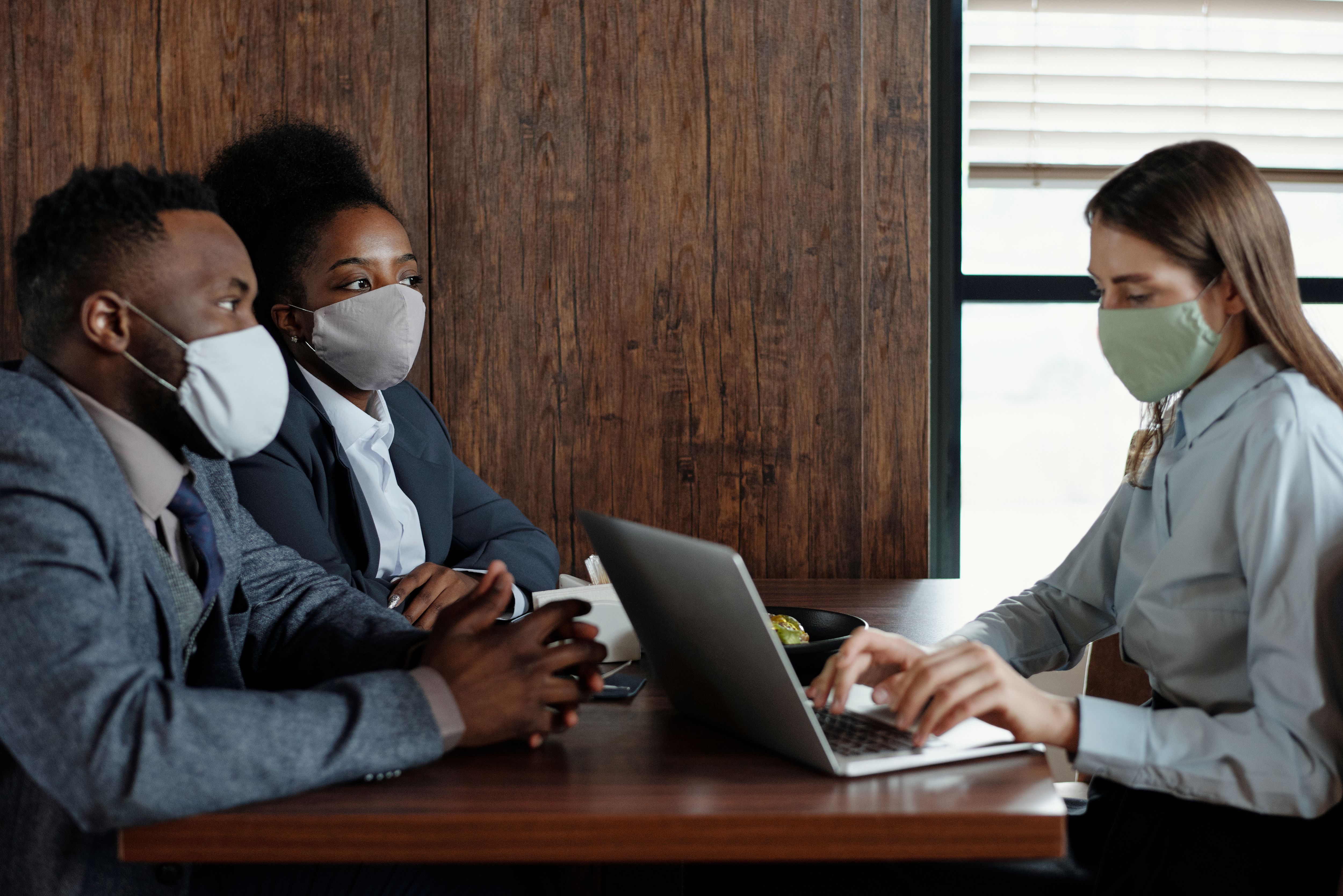 Business People Wearing Face Masks on a Meeting · Free