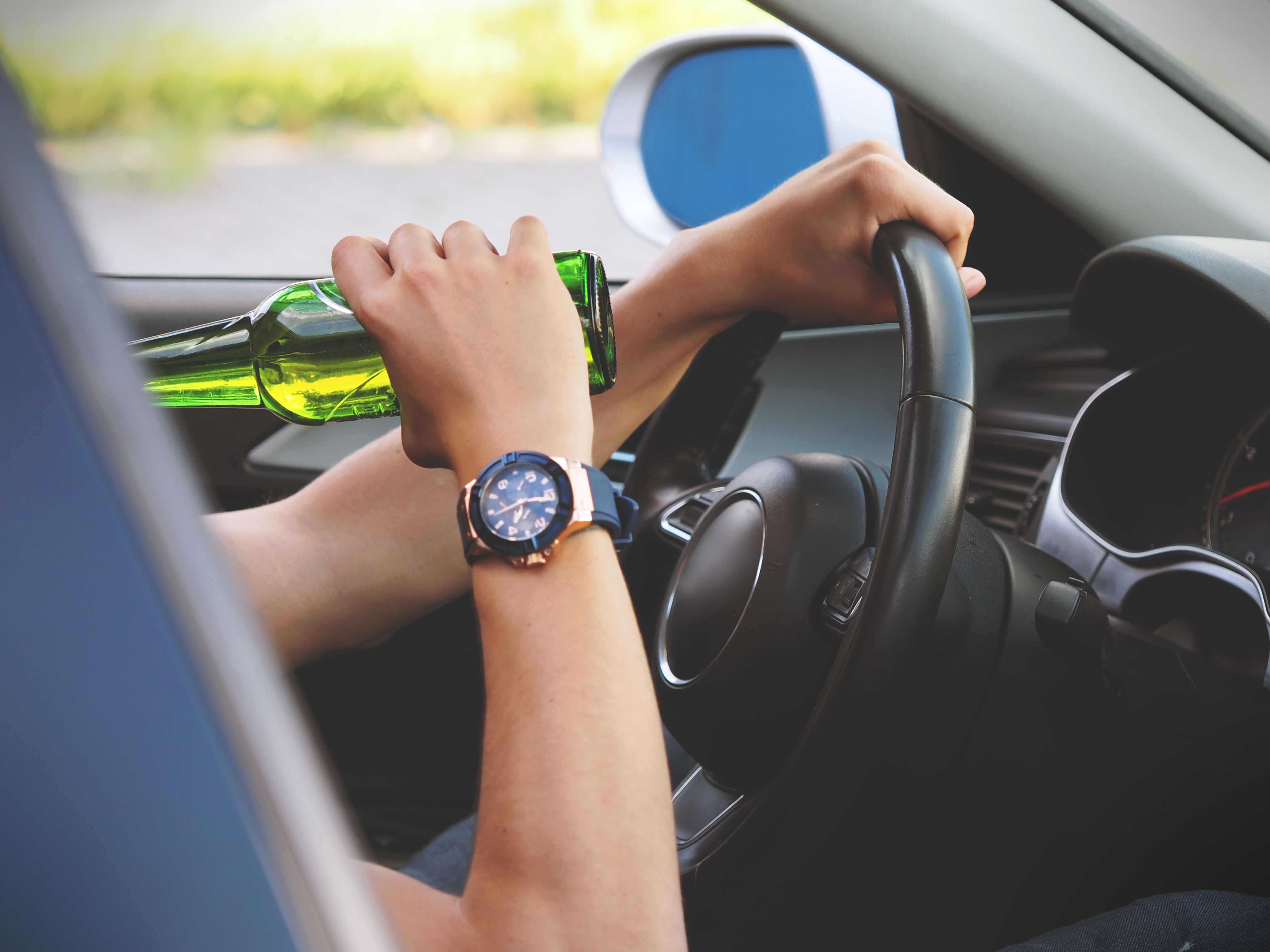 Person Driving and Drinking · Free