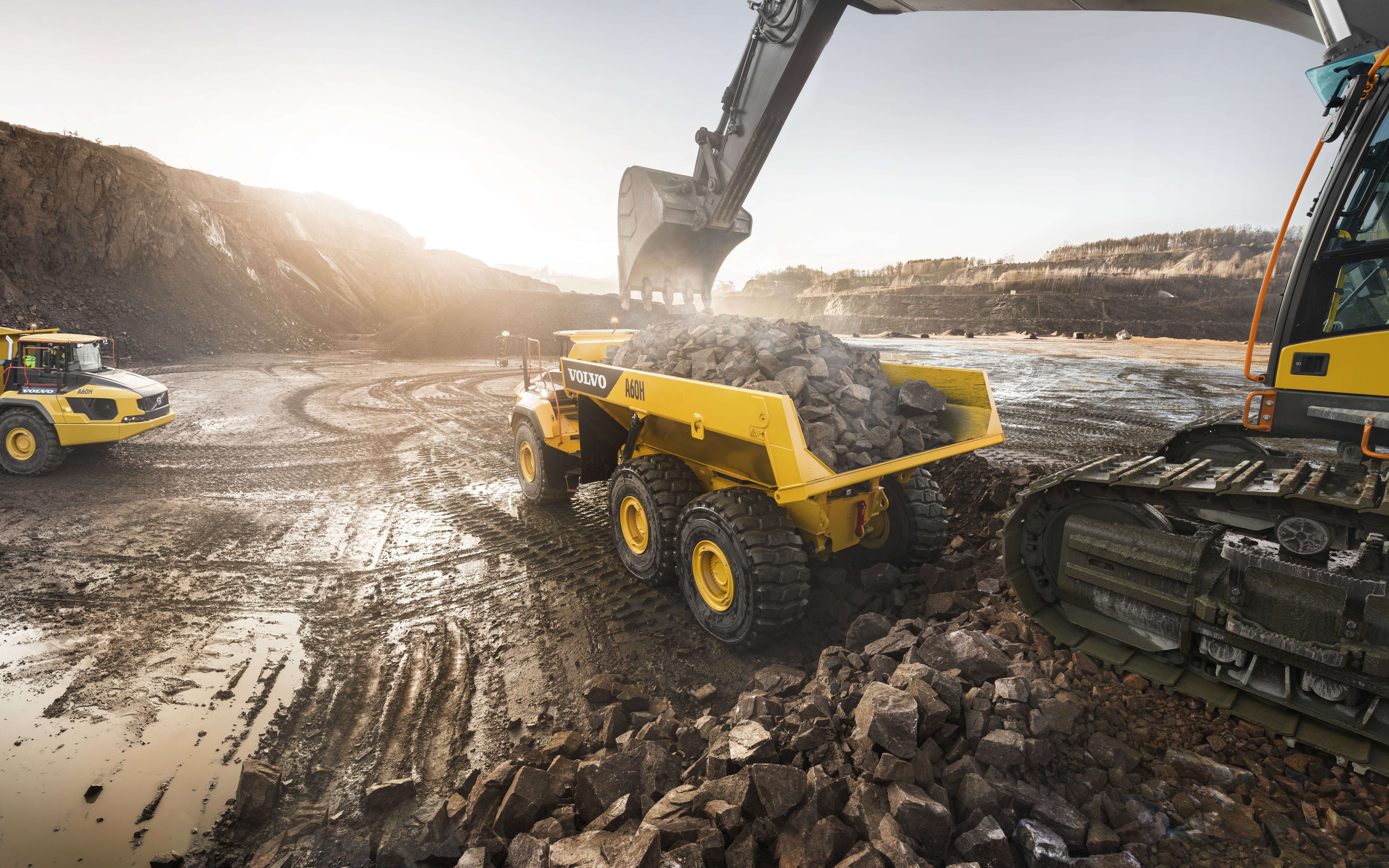 Download wallpaper Volvo A60H, Heavy duty dump truck, loading of stones, quarry, excavator, Swedish trucks, construction machinery, Volvo for desktop with resolution 7680x4800. High Quality HD picture wallpaper