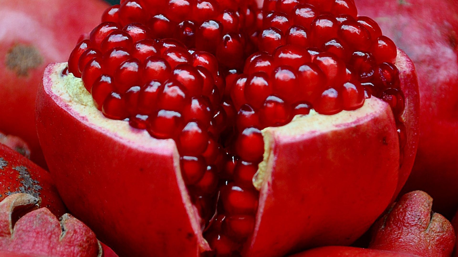 Download wallpaper 1920x1080 pomegranate, fruit, slice full hd, hdtv, fhd, 1080p HD background