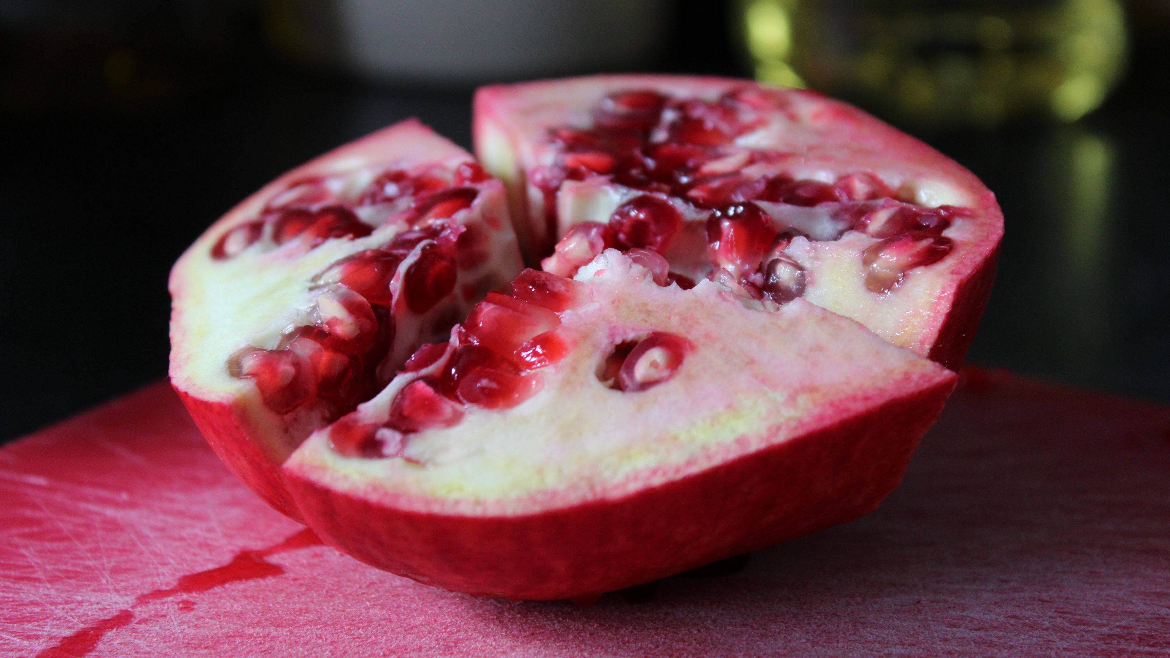 Download wallpaper 3840x2160 pomegranate, fruit, slice, juicy 4k uhd 16:9 HD background
