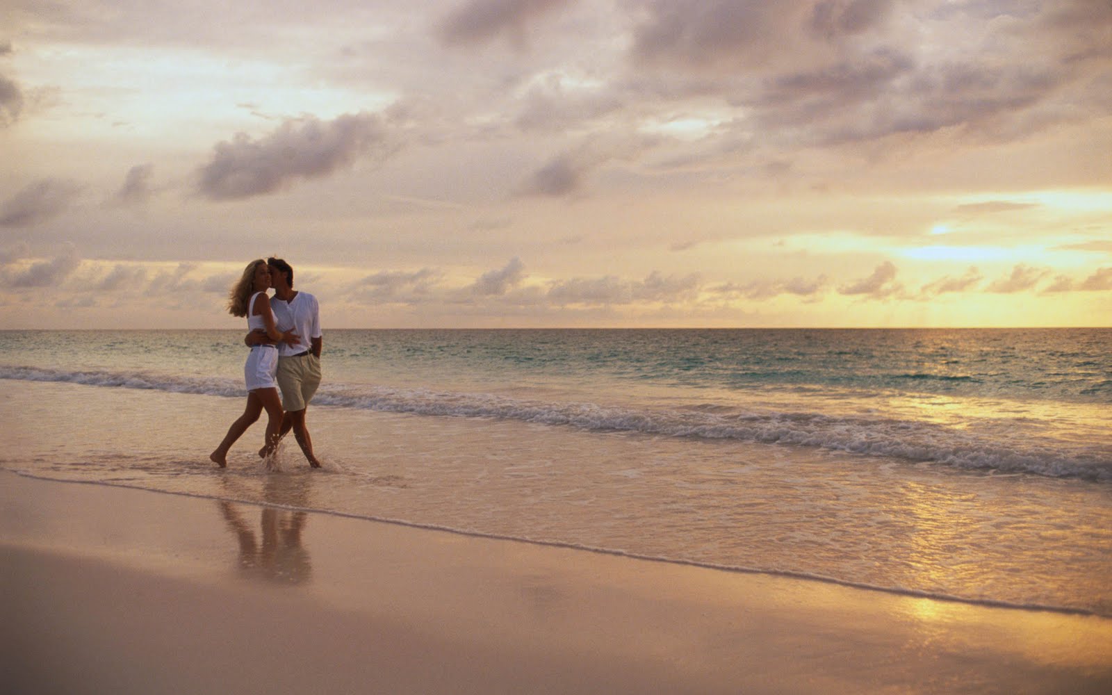 Lovely couple walking along the sea on the beach wallpaper. Home of Wallpaper. Free download HD wallpaper