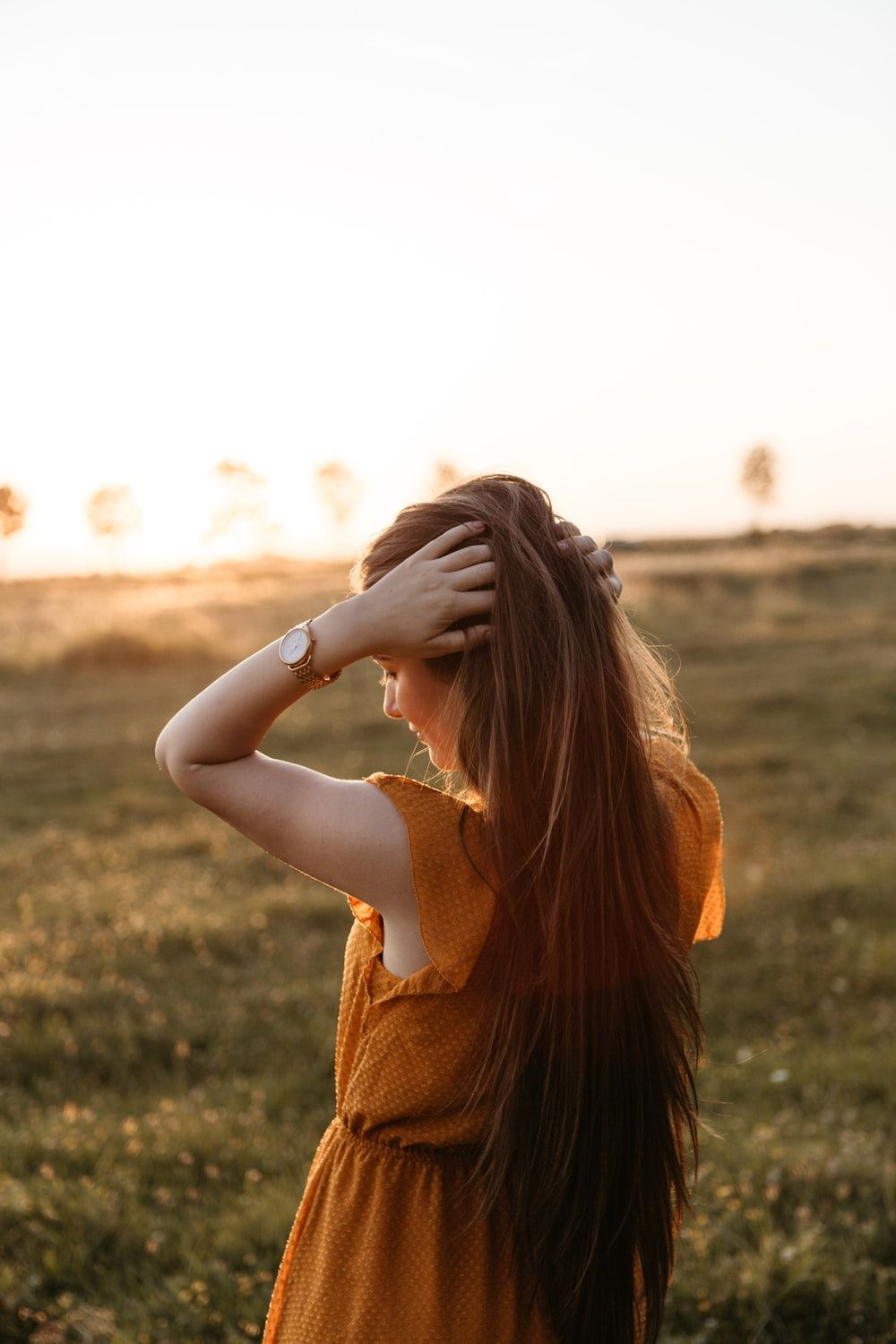 woman holding her hair photo