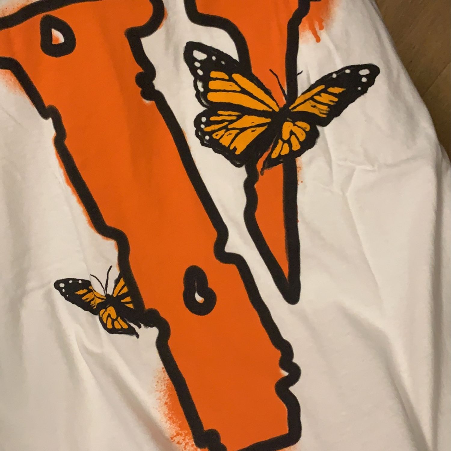 orange butterfly vlone shirt