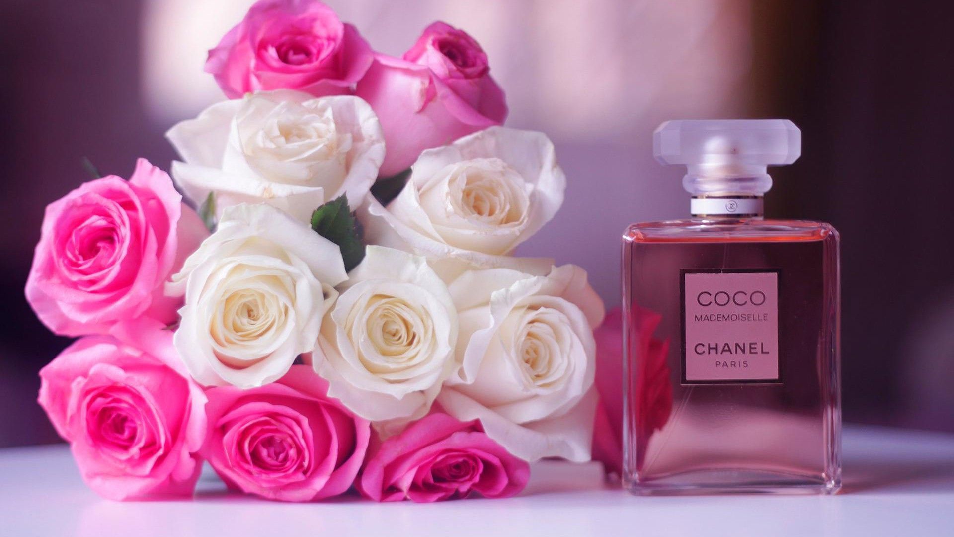 coco chanel perfume with flowers in blur backgrounds hd chanel Wallpapers.